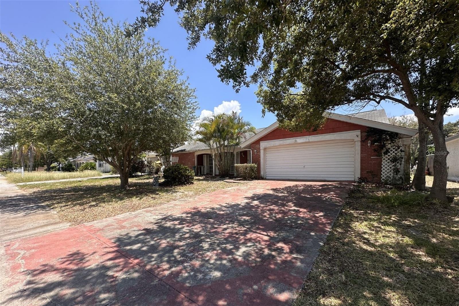 Bring your vision and transform this spacious 1,519 sq. ft. home into something truly special. Featuring 2 bedrooms, 2 bathrooms, a 2-car garage, and a large covered lanai, this property offers an excellent floor plan with the potential to easily convert into a 3-bedroom home, adding instant value. Inside you’ll find multiple living spaces, a generously sized kitchen overlooking the family room, an expansive living room filled with natural light, an indoor laundry room, and a primary suite with ample closet space. The oversized covered lanai extends your living area outdoors and overlooks the private backyard, making it the perfect place for entertaining once restored. While the home is ready for updates, the bones are here: solid layout, spacious rooms, and endless possibilities for a homeowner, flipper, or investor looking to create equity. Whether you’re dreaming of a modern open-concept renovation or searching for your next investment project, this home offers the square footage and flexibility to make it happen.