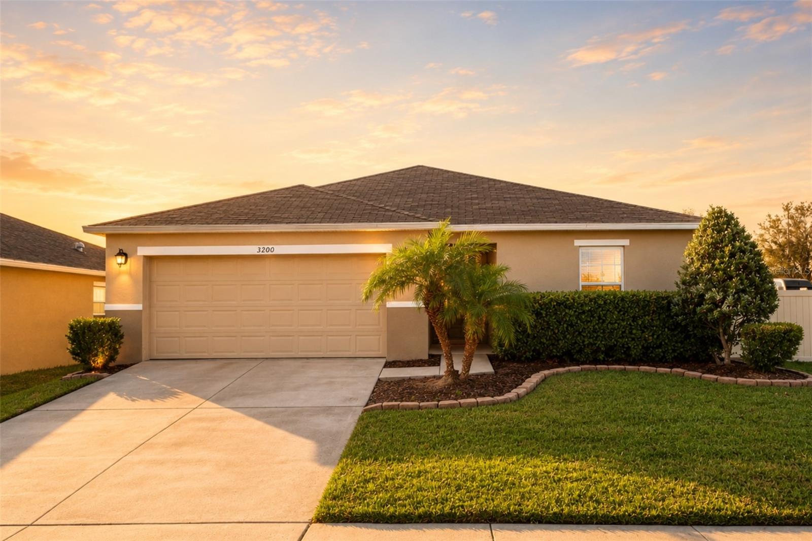 Beautifully 4-bedroom, 2-bath home built in 2020, ideally positioned on a desirable corner lot in the Casa Bella community of Kissimmee. This property features an inviting open-concept layout with elegant wood-look tile flooring throughout the main living areas and carpet in bedrooms, offering comfort and style. The kitchen includes granite countertops, stainless steel appliances, wood cabinetry, a breakfast bar, and a stylish tile backsplash perfect for cooking and entertaining. The living and dining areas receive abundant natural light, creating a warm and welcoming atmosphere. The master bedroom features a spacious layout with a double-sink vanity and excellent storage. Step outside to enjoy a covered back porch ideal for relaxing, along with a fully fenced backyard that offers privacy and room for outdoor enjoyment. This home provides convenient access to major highways, schools, shopping, restaurants, medical facilities, and local attractions. Don’t miss the opportunity to make this wonderful property yours schedule your showing today!