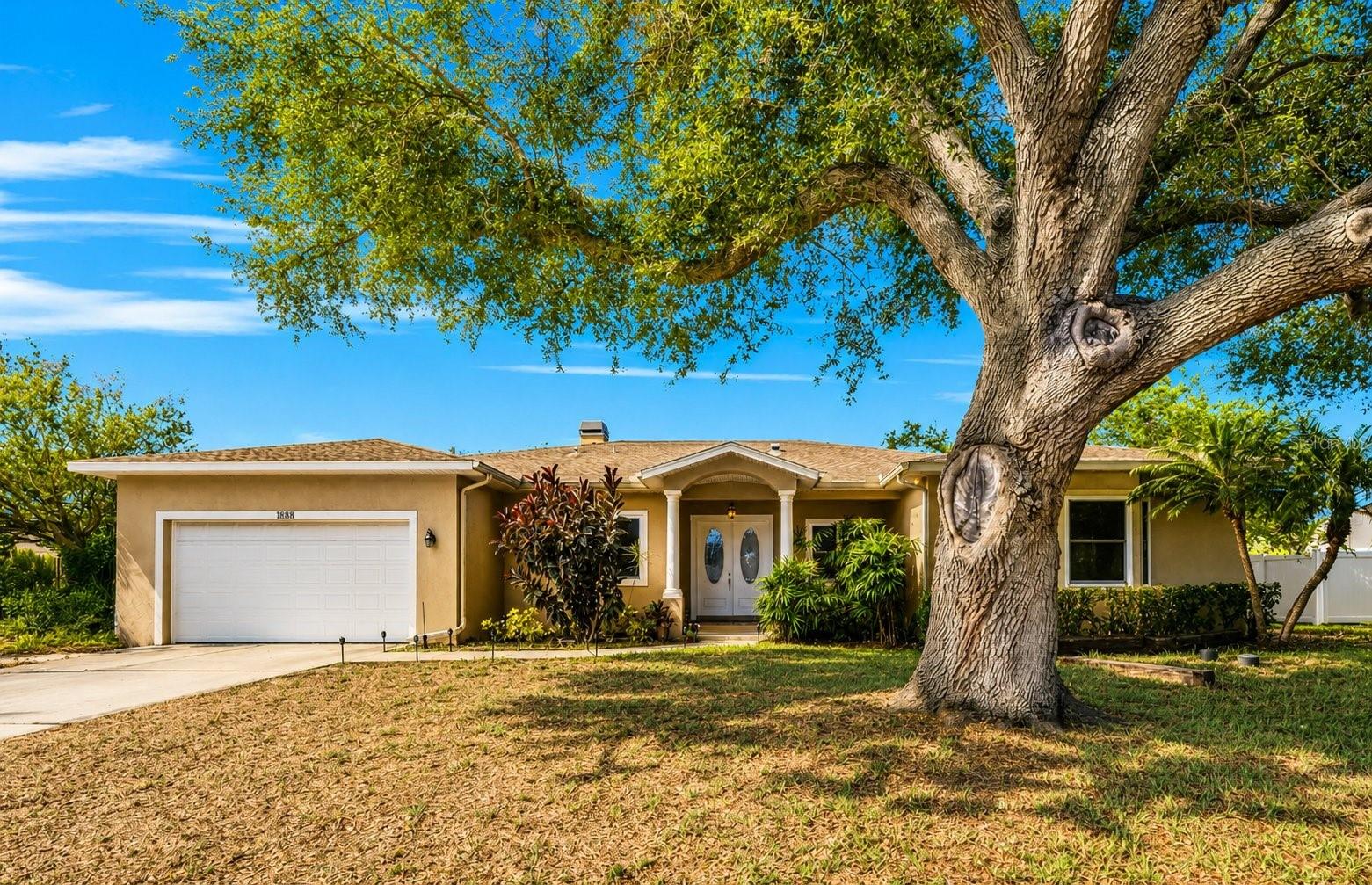 Virtually Staged. A Rare Multigenerational or Multi-Family Opportunity in the Heart of Clearwater!
Stunning 4-bedroom, 3-bath, 2-half bath, single-story home built in 2007 with newer building code, offering 3,042 square feet of luxurious living with mature landscaping and NO HOA. From the moment you arrive, lush tropical landscaping, swaying palms, and a charming front garden pond set the tone for everything this exceptional home has to offer.
Step inside through the grand 9x9 foyer and you are immediately greeted by 10-foot ceilings, rich crown molding throughout, 5.5-inch baseboards, knock-down ceilings, and an abundance of natural light through impact windows. Every detail has been thoughtfully curated — from the upgraded two-panel doors with nickel finish knobs and accents to the fresh interior and exterior paint on all doors, trim, and casings. Fully wheelchair accessible.
The heart of this home is the spacious 11x20 kitchen, featuring solid wood cabinetry with crown and base trim, elegant Corian countertops, nickel faucets, and natural gas cooking.  The City of Clearwater provides natural gas service for the stove, fireplace, dryer and heat source.  The adjacent 10x13 dining room flows seamlessly into the 15x13 living room, where a natural gas fireplace creates the perfect gathering space. 
The grand primary suite measures an impressive 15x20 and features double-door access directly onto the covered, expansive pavered back patio. The spa-inspired primary bath includes Corian countertops, an upgraded 7x9 walk-in shower with brand new glass door and panel, an inside linen closet, a private toilet room, and a luxurious Oceania AeroMassage tub. The 10x11 primary walk-in closet is a room of its own!
Two generously sized Jack and Jill bedrooms — 13x17 and 13x14 — share a beautifully appointed 8x11 bathroom with a new shower door. Bedroom 2 boasts both a built-in and a walk-in closet, while Bedroom 3 features a 4x6 walk-in closet and its own 6x8 office area — ideal for a student, guest, or second work-from-home space. Bedroom 4 serves as a second grand primary suite, complete with a walk-in closet and walk-in shower.
Work from home in style with a generous 9x9 dedicated office featuring a separate alcove perfectly sized for a V-shaped executive desk. The home also features a convenient 6x6 powder room and a 4x7 pool half bath and outdoor shower — already in place for a future pool addition. Adjacent to the office, on the other side of the foyer, is an incredible bonus room previously used as a music room, featuring sound-insulated walls and a dramatic double-door entrance — the perfect creative space, media room, or private retreat.
The 9x7 laundry room is fully loaded with a Whirlpool front-load washer and dryer, a utility mud sink, cabinetry, and hanging space. The oversized 22x27 deep garage features a newer garage door (2024) with ample room for two vehicles plus attic storage.   The HVAC system was replaced in 2022 and a Tankless HWH was installed 2026.
Outdoors, relax and entertain on the expansive 13x40 covered pavered back patio, perfect for hosting family and friends year round. Beyond the patio, escape to your own private tropical oasis — a 16x23 outdoor entertainment area complete with a fire pit, tiki torches, and a sandy, beach-inspired atmosphere that captures the true spirit of Florida living. 
Conveniently located in the heart Clearwater, minutes from world-class beaches, dining, shopping, and top-rated schools. A Must See!