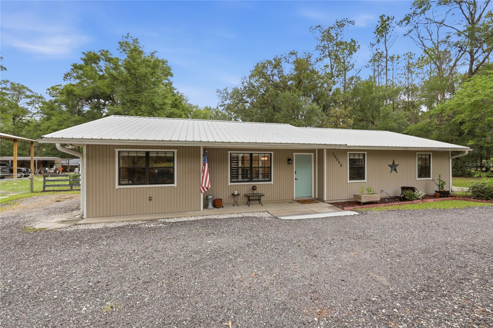 Virtually Staged. Welcome to Kanapaha Pines!  This 3-bedroom, 2-bathroom home offers 1,420 square feet of living space on a spacious 1.14-acre lot.  Step
inside to a bright and inviting living and dining room.  Featuring French doors that open to the backyard, creating a seamless flow for indoor and outdoor living.  The updated kitchen offers both style and functionality.  At the same time, the hallway leads to the primary suite, complete with a walk-in closet and an updated private bathroom with a tub/shower combination.  Durable vinyl plank flooring runs throughout the home for easy maintenance and a modern look. Just off the living room is an additional room that can be used as an office, home gym, or even an additional bedroom; the possibilities are endless. Outside, you'll find a fully fenced backyard with plenty of room for pet, gardening, and recreation.  This property also features a 30X36 pole barn that has a concrete slab with 1,080 square feet that was built in 2024. This provides space for storage for your boat, RV, or any of your hobbies. Cool off in the 16'X24" above-ground pool with surrounding deck, Doughboy pool liner that has a lifetime warranty.  Pool has a 1.5 HP pump and 24-inch filter.  Additional upgrades include a new water heater and a metal roof installed in 2022.  This property is conveniently located just off Archer Road with easy access to I-75, Butler Plaza, Celebration Pointe, and the University of Florida. This is a wonderful opportunity to enjoy country-style living with all the conveniences of Gainesville just minutes away.
