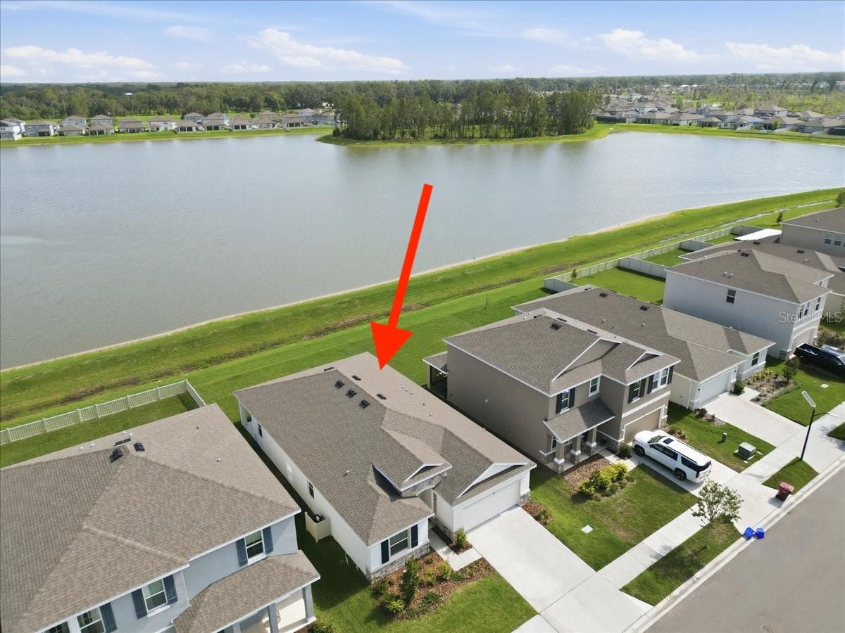 Built in 2023 and better than new, this beautifully upgraded 4 bedroom, 2.5 bath home offers over 2,000 square feet of thoughtfully designed living space with a 2 car garage and one of the most desirable WATERFRONT homesites in the community. Wake up to breathtaking views of the community lake from your backyard and enjoy peaceful sunsets from your own private retreat. Inside, you'll find upgrades that go beyond the builder-grade finishes, creating a home that is truly move-in ready. The kitchen and living spaces flow seamlessly for everyday living and entertaining, while a whole-home WATER SOFTENER provides added comfort and convenience. The community offers an exceptional lifestyle with RESORT STYLE AMENITIES including a sparkling pool, clubhouse, pickleball courts, basketball courts, parks, playgrounds, scenic walking trails, expansive green spaces, and a kayak launch providing direct access to the community lake. Conveniently located just 1.5 miles from South Florida Baptist Hospital, less than 10 minutes from historic Downtown Plant City, under 20 minutes from Downtown Lakeland, and less than 30 minutes from Downtown Tampa, this home offers the perfect balance of peaceful waterfront living and easy access to shopping, dining, healthcare, and entertainment. Why wait to build when you can enjoy a like-new home with premium upgrades, stunning water views, and an unbeatable location today!
