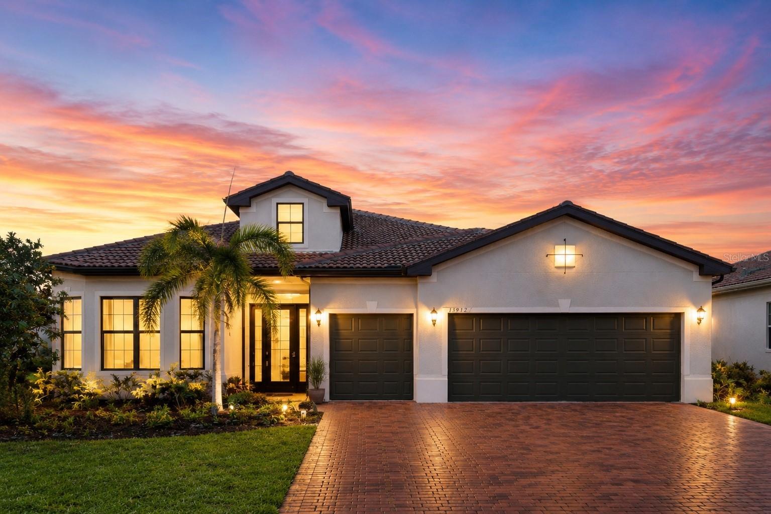 One or more photo(s) has been virtually staged. THIS HOME TRULY SHOWS LIKE A PERFECT, MOVE-IN READY MODEL HOME! Absolutely stunning and exceptionally welcoming, this CUSTOM-DESIGNED, meticulously maintained STONEWATER MODEL by DIVOSTA, move-in-ready residence is located in the gated, resort-style community of Islandwalk, one of Venice’s most desirable neighborhoods offering exceptional amenities and an active Florida lifestyle.
This beautiful, very spacious 3BD + OFFICE, 3BA, 3 CAR garage,with EXPANSIVE LANAI residence features a 2,855 SQ FT of heated thoughtfully designed living space with quality, comfort, and attention to detail in mind. The inviting open floor plan is filled with abundant natural light, generous room sizes that create a warm and welcoming atmosphere. CUL-DE-SAC location, one of the best in the whole Islandwalk commuity. NOT in the FLOOD ZONE. The expansive living and dining areas flow seamlessly to the extra-large screened lanai overlooking a tranquil water view with two picturesque bridges in the distance, providing the perfect setting for relaxing, entertaining, and enjoying Florida’s beautiful weather and stunning sunset views. The gourmet kitchen is beautifully appointed with tall real-wood cabinetry, quartz counters, built-in oven, stylish cooktop, KitchenAid appliances, and a walk-in pantry with custom gray built-in shelving offering exceptional storage and organization.The primary suite is a private retreat featuring a spa-like ensuite bath with walk-in shower and ample custom closet space. Two additional bedrooms and two full baths provide flexibility for guests or family. A generously sized office/den with abundant natural light offers versatility for working from home, study, or creative use. The designer laundry room includes custom cabinetry, expansive counter space, and outstanding organization—making everyday tasks effortless. Tile flooring throughout the living areas, kitchen, bathrooms, office, and laundry room, with quality engineered hardwood flooring in all bedrooms. THE HOME ALSO FEATURES IMPACT WINDOWS AND SLIDERS THROUGHOUT, STORM SMART HURRICANE SHUTTERS ON THE LANAI, AN EXTRA-STRONG LANAI STRUCTURE WITH REINFORCED CONSTRUCTION AND SCREENING, ADDITIONAL ATTIC INSULATION FOR ENHANCED ENERGY EFFICIENCY, A CENTRAL VACUUM SYSTEM, EPOXY FLOORING IN THE GARAGE, ELEGANT COFFERED CEILINGS IN THE LIVING ROOM, TRAY CEILINGS IN THE PRIMARY BEDROOM, OFFICE, AND ONE GUEST BEDROOM, CROWN MOLDING THROUGHOUT, A SEALED PAVER DRIVEWAY ENHANCING CURB APPEAL. 3-car garage offers room for multiple vehicles, a golf cart, or extra storage. Residents of IslandWalk at the West Villages enjoy access to two resort-style amenity centers, featuring grand clubhouses, resort and lap pools, two hot tubs, fitness centers, 12 pickleball courts,8 tennis courts,bocce courts,basketball court,walking and biking trails, waterfront parks, dog park, playground, community garden, nature preserve, and a vibrant calendar of social activities.Ideally located just minutes from world-famous Gulf beaches, shopping, dining, entertainment, medical facilities, and top-rated schools. The home is also conveniently close to Wellen Park, Venice’s beautifully designed new downtown destination offering upscale dining, boutique shopping, entertainment, and year-round community events.This stunning home shows like a model and offers an exceptional Florida lifestyle. Everything you’ve been searching for is right here. Schedule your private showing today—and be sure to explore the 3D tour and video!