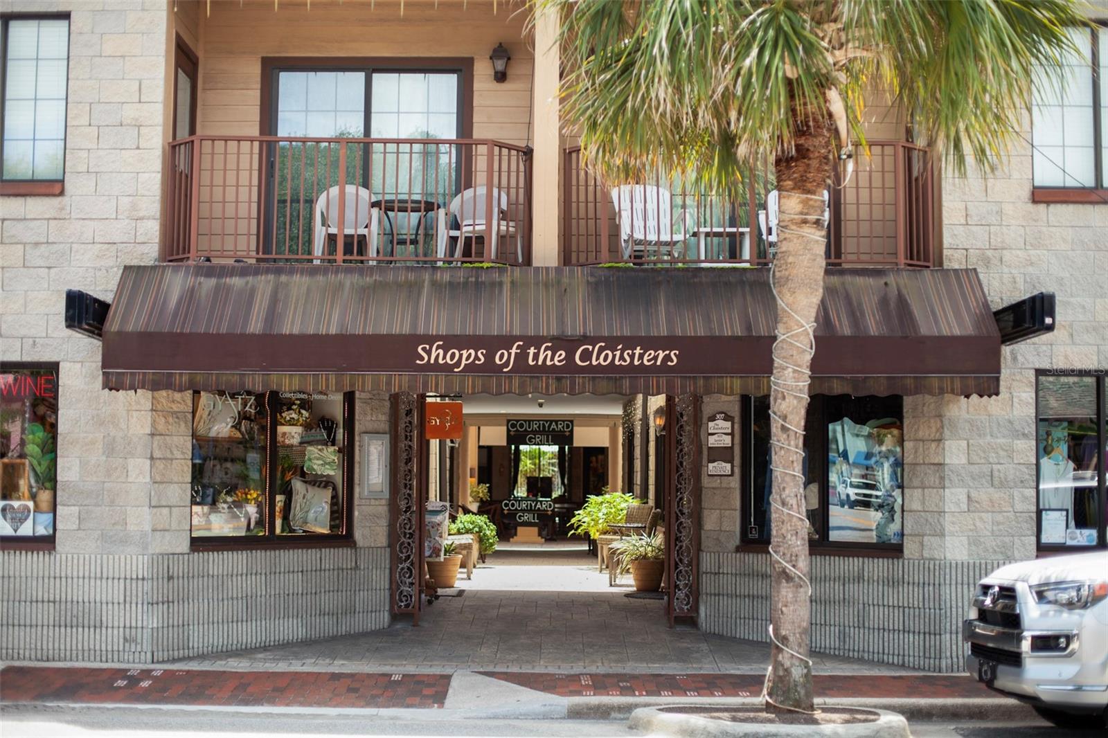 LOCATION, LOCATION, LOCATION.  Rare Opportunity in the heart of beachside New Smyrna Beach.  This unique 5 parcel property is located on busy historic Flagler Avenue within walking distance to one of the most visited beaches in Florida.  Flagler Avenue is lined with shops, restaurants and three quaint hotels.  The listed properties include:  Retail space (1170 sq.ft.) with frontage on Flagler Avenue, which has operated for 19 years as an upscale gift store.  The store also had a Series 2AP license to sell package wine and beer, and conducted wine tastings at the adjacent restaurant.  The restaurant space (920 sq.ft.) includes a cozy 6-stool bar with 3-4 tables and a kitchen with gas appliances and a fire suppression hood system and an adjacent Restaurant space (443 sq.ft.) which has been used for special events and storage.  There is an additional 900 sq.ft. of covered outdoor seating in the charming courtyard, under an existing lease from the Cloisters Condo Owners Assn.  The tenants of the restaurant space have held a 2-COP license to serve wine and beer since 2014.  The commercial retail and restaurant spaces , if combined, have 16 allocated parking spaces which could be used to meet the City of New Smyrna Beach parking requirements for a 96-seat restaurant.  In addition to the commercial spaces, there is a residential unit on the second floor above the retail space.  It is a well maintained 3 bedroom, 3 bath, (1440 sq.ft.) condo with an open floor plan, and an air conditioned 1 car garage (247 sq. ft.).   The residence is perfect for Owner or Manager and is being offered at $420,000 with the purchase of the commercial parcels.