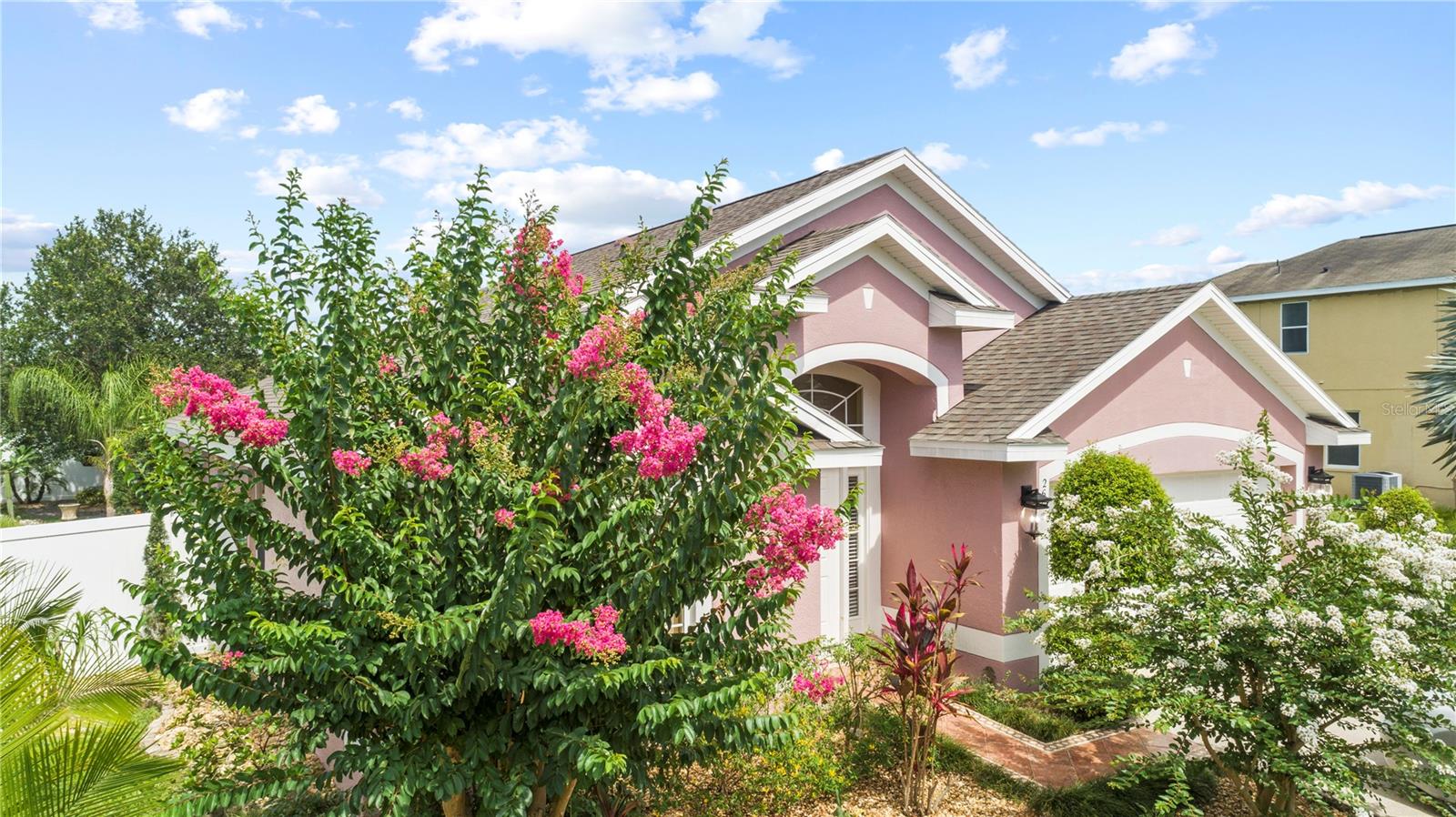 Welcome to 2605 Sunningdale Drive — a meticulously upgraded 4-bedroom, 2-bathroom home nestled in the sought-after community of Eagle Lake in Kissimmee, FL. This is the home that checks every box — and then some.  Step inside and you'll immediately notice what's missing: carpet. There is none. The entire home — including the 2-car garage — features clean, durable porcelain tile throughout, giving every room a polished, move-in-ready feel that's easy to maintain and beautiful to live in.  The kitchen is the heart of this home, featuring Zodiac countertops and a full suite of KitchenAid stainless steel appliances (2020). Those same premium Zodiac countertops extend into the bathrooms — because quality doesn't stop at the kitchen door.  The primary suite is a true sanctuary, spanning 360 total square feet that include the bedroom, en-suite bath, and walk-in closet. Three additional bedrooms offer flexible space for the whole family.  The big-ticket upgrades? Already done: New roof (2018). New Carrier A/C system (2021) with a 10-year warranty. New water heater (2021). Plaster exterior paint (2021) with a transferable 30-year warranty. Premium vinyl fence — valued at $6,500 — for a private, beautifully enclosed backyard. These are the upgrades that matter most — and they're already taken care of.  Eagle Lake offers the lifestyle to match: two community pools, basketball court, soccer field, tennis courts, clubhouse, and walking/cycling trails — all just minutes from shopping, dining, Publix, and an easy drive to Disney and all of Central Florida's best.  Furniture is available and negotiable. This one is priced to move, built to last, and ready for you. Schedule your private showing today — Appointment Required, 24-Hour Notice.