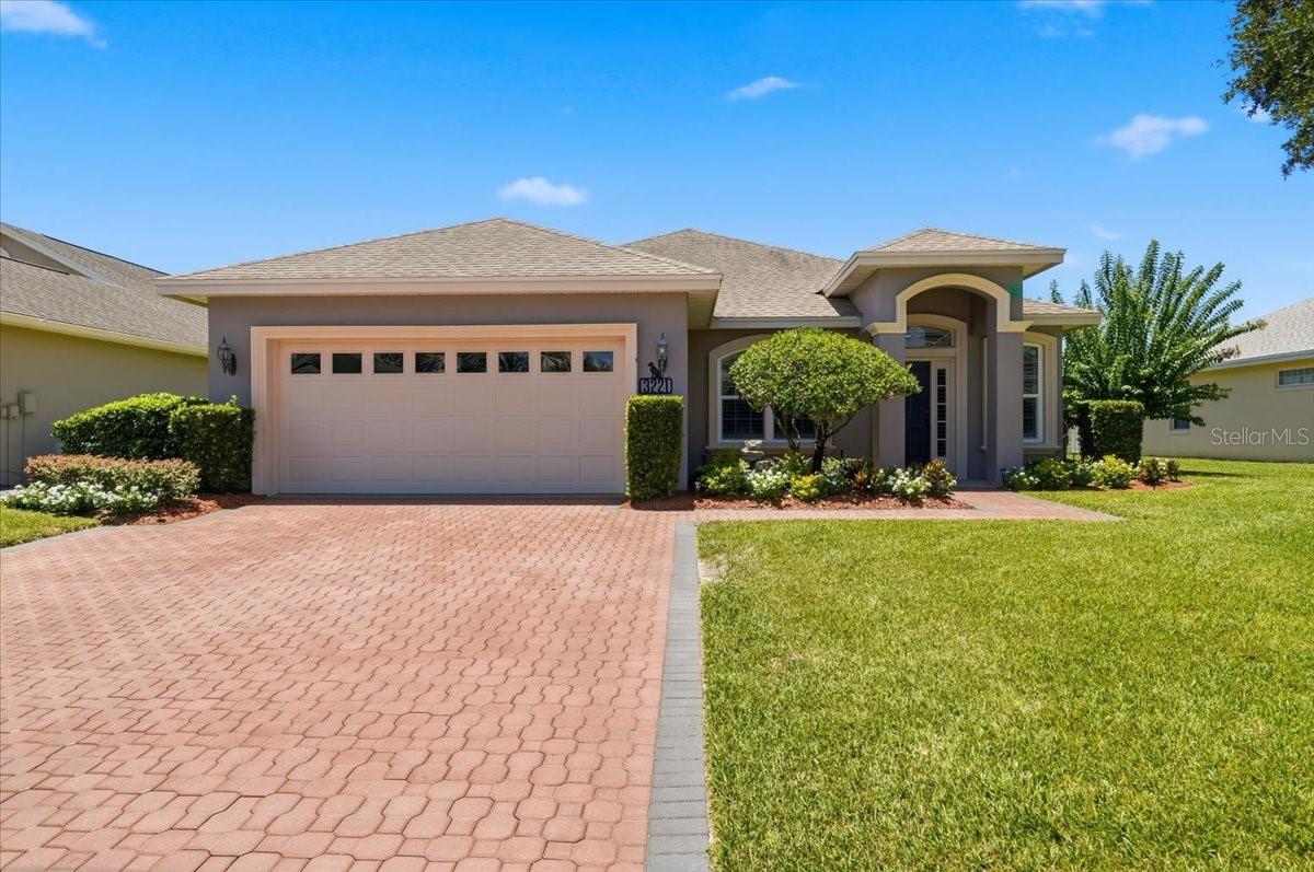 "A Step Above the Rest" describes this beautifully updated 3BR/2BA home  w/ upgrades galore located on a quiet dead-end street in the Oakgrove part of the desirable Cypresswood Golf & Country Club community!  This impeccably maintained home has lush landscaping & extensive curb appeal & offers an open concept with split bedrooms, volume ceilings, crown molding, plantation shutters & luxury wood laminate flooring throughout accompanied with lovely new tile flooring in the bathrooms.  The inviting formal living & dining areas are adorned with arched entryways that lead into the remodeled kitchen & the spacious great room that boasts a tray ceiling & triple sliders leading to the large screened lanai.  The lovely kitchen has updated cabinets with a new tile backsplash & pretty granite countertops w/ a waterfall edge, a bi-level breakfast bar, a pantry closet & it comes fully equipped with all of the upgraded appliances.  The primary suite has a tray ceiling, sliders leading to the screened lanai, & a nice sized walk-in closet.  The remodeled primary bath has duo vanities & sinks w/ quartz countertops & a nicely tiled step-in shower w/ a sleek glass enclosure.  The hallway bathroom has also been remodeled & features a new vanity w/ quartz countertop & a freshly tiled tub & shower combo & it's conveniently located between the 2nd and 3rd bedrooms.  You'll really love the large, extended screened lanai w/ it's stylish "brick looking" tiled floor, a remote controlled sun shade, doggy doorway options & it's all overlooking the beautifully landscaped privacy fenced back yard making it the perfect place for entertaining.   There's even an extra covered patio w/ a gas line for your grill!  Additional features include an inside laundry room, a double car garage, a whole-house gas generator, new hurricane windows in the formal areas plus hurricane shutters for all the other windows, custom honey comb shades on all the sliders & plantation shutters throughout!  The roof & A/C system are both only about 4 years old!  The 24 hour guard gated Cypresswood community features an 18-hole championship golf course, a wonderful clubhouse w/ pub/restaurant, fitness room, pro shop, junior Olympic swimming pool, pickle ball, tennis courts & more!  Conveniently located near shopping, restaurants, medical, the new Publix & Legoland.  Located in the heart of Central Florida between Orlando & Tampa and just minutes from Highway 27 leading to the I-4 corridor & all major attractions!   All measurements are approximate & all info should be confirmed by buyer.