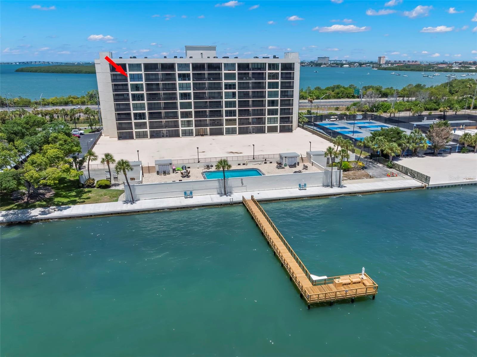 Welcome Home!!! Imagine waking up to the beautiful sunrises over Tampa Bay from your very own bedroom and living room. Welcome to a turn-key 2-bedroom, 2-bath home that is filled with natural light taking you to he epitome of waterfront and coastal living. The floor-to-ceiling windows throughout are where elegance and comfort combine nicely to bring the sparkling Tampa Bay to you. The open floor-plan with 2 spacious bedroom with full ensuites where you have amazingly expansive views with sliding glass doors from every room and from 2 private and screened balconies.

The kitchen hosts a coastal vibe with glass tile backsplash and is perfect for entertaining with generous granite counters providing plenty of space for preparation and serving. Wood mission style cabinetry with custom features, stainless steel appliances and a pantry to provide extra storage. Just off of the mirrored dining area featuring reflections of your water views all while being able to socialize with guests in the living room. This end unit lives much larger than you would imagine… It is a MUST SEE. Located just minutes from Downtown St. Petersburg, Eckerd College, Gulf beaches, and I-275, this property is ideal as a primary residence, seasonal retreat, or investment opportunity. Experience the best in Florida waterfront living in one of St. Petersburg’s most scenic bayfront communities. Additional features include secure under-building parking (space #703), a large private indoor storage closet, and there are nearby laundry facilities on every floor. Bridgeton North has recently completed a series of tasteful enhancements, including fresh exterior finishes, a modernized lobby, upgraded fitness center, billiard room and improved meeting and gathering spaces—further elevating the boutique coastal lifestyle offered here. All improvements have been fully funded. Residents enjoy an impressive array of waterfront amenities: Heated saltwater pool overlooking the Bay and Skyway Bridge, Outdoor grilling terrace and direct access to scenic walking trails connecting to Maximo Park and Sunshine Skyway State Park. The community is pet-friendly with no age restrictions, and the monthly association fee includes water, sewer, trash, cable, internet, and building maintenance. Perfectly situated, you are just minutes from award-winning Gulf beaches, marinas, boating, golf, renowned dining, shopping, parks, airports, and vibrant downtown St. Petersburg. This beautiful turn-key unit  blends luxury, serenity, and captivating water views into one truly unique package. A truly exceptional opportunity to own a premier coastal residence. 

The Bridgeton North building is well maintained with pride. Bridgeton North has completed the MILESTONE INSPECTION / HOA STUDY required by the 2022 Condo Guidelines. Bridgeton Condominiums is a 9-story, 64-unit waterfront building. This is the place to be… call today for your private showing.