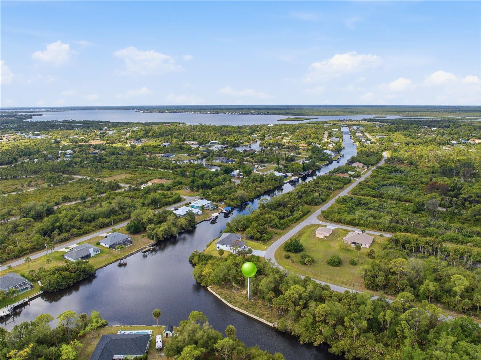 Build your Florida waterfront dream home on this oversized 0.34-acre canal lot located on the beautiful Markham Waterway in the growing Northwest Port Charlotte area. Offering direct boating access to Charlotte Harbor and the Gulf waters beyond, this property is ideal for boating, fishing, kayaking, and enjoying the Southwest Florida lifestyle. Featuring a brand-new 166-foot seawall built in 2024, this nearly 15,000 sq. ft. parcel is already prepared for your custom coastal retreat. Enjoy peaceful canal views, privacy, and endless potential for a custom home, pool, and outdoor entertaining space in this peaceful and lightly developed waterfront setting. Conveniently located near shopping, dining, golf, beaches, and Atlanta Braves Spring Training facilities. Don’t miss this opportunity to own a prime piece of waterfront paradise.