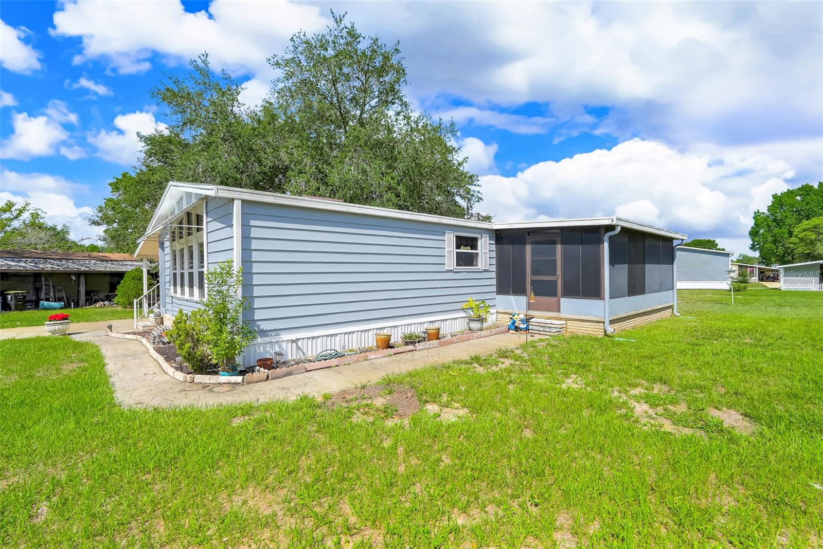 Welcome home to your Florida Retirement Living!  This charming 2-bedroom, 2-bath manufactured home located in a desirable 55+ golf cart-friendly community! Nestled on a peaceful cul-de-sac, this spacious home offers a comfortable and functional floor plan designed for both relaxation and entertaining.
Inside, you'll find a bright living room, a well-appointed kitchen featuring a center island, a separate dining room, and a convenient wet bar area perfect for hosting family and friends. The den/study provides flexible space for a home office, hobby room, or reading retreat. The primary suite offers comfort and privacy, while the second bedroom and bath are ideal for guests.
Additional features include a one-car garage, plus an outdoor shed with workshop space for storage, projects, and hobbies.
Enjoy an active lifestyle with access to the community's swimming pool, golf course, and numerous amenities and activities. Whether you're looking for a year-round residence or a seasonal getaway, this home offers the perfect blend of comfort, convenience, and community living.
Schedule your private showing today and discover all that this wonderful home and community have to offer!