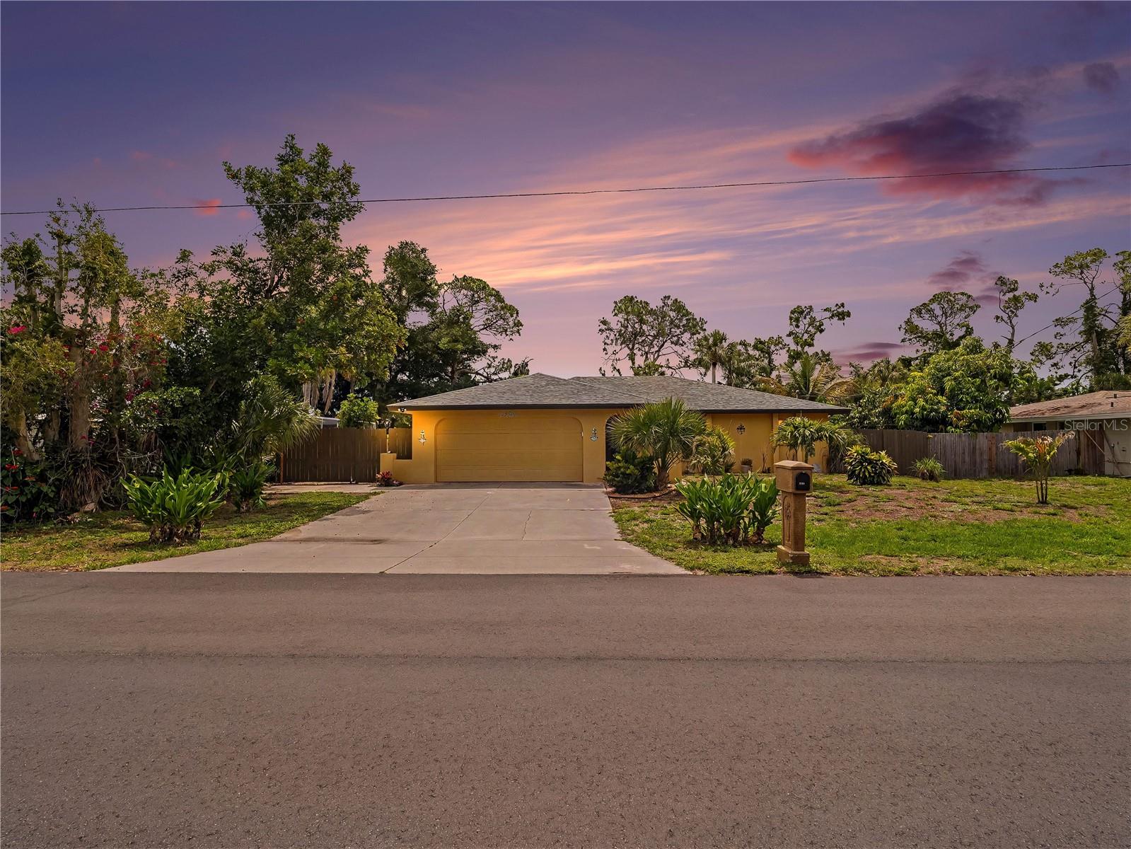 Welcome to your private waterfront retreat in the heart of Nokomis! Perfectly positioned on a picturesque freshwater canal ideal for fishing, kayaking, and paddleboarding, this beautifully updated 2-bedroom, 2-bath home offers the Florida lifestyle you've been dreaming of—with no HOA, no CDD fees, and no flooding from recent storms.  From the moment you arrive, you'll appreciate the thoughtful updates and exceptional outdoor living spaces. The backyard is truly a showstopper, featuring a newer heated saltwater pool complete with a tanning ledge, decorative fountains, travertine decking, and an oversized screened cage that creates the perfect setting for entertaining or relaxing year-round.
Inside, the home blends modern finishes with coastal charm. The kitchen is designed to impress, showcasing sleek dark wood flat-panel cabinetry, commercial-grade stainless steel appliances, a professional range hood, intricate glass tile backsplash, commercial stainless workspace, and a stunning raw-edge granite breakfast bar. A spacious walk-in butler's pantry provides abundant storage and functionality.
The open living area features tile flooring throughout and a striking shiplap accent wall that adds warmth and character. The primary suite offers a walk-in closet, beautifully updated tiled shower, and convenient access to a flexible den or office space. The guest bedroom also includes a walk-in closet and plantation shutters for added privacy. Both bathrooms have been tastefully renovated with modern tiled showers.
Additional highlights include a laundry/mud room with a soaking tub perfect for pet washing, a two-car garage with epoxy floors, workshop space, and extra storage. RV owners will appreciate the dedicated parking area and electrical hookups. An adorable detached shed offers endless possibilities as an art studio, she shed, hobby room, or creative workspace.  Major updates provide peace of mind, including a new roof and air conditioning system in 2023, along with impact windows throughout. Conveniently located less than 15 minutes from Nokomis Beach, Publix, Walmart, Starbucks, popular local restaurants, and the charming shops and dining of historic downtown Venice, this waterfront gem offers the perfect combination of privacy, convenience, and coastal living.
