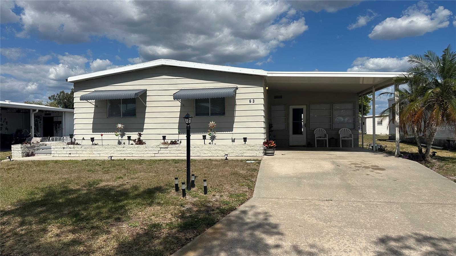 Welcome to Shadow Brook, an All-Ages, Pet Friendly, mobile home park in North Palmetto. This 1982 Manufactured home is a Rare Gem since it features 3 BEDROOMS, 2 bathrooms, 1008 square feet, a large, enclosed Lanai that is a great area for entertaining family and friends. The home was recently remodeled including all new Luxury Vinyl Plank Flooring, some new appliances, a New TPO Roof installed in 2024 with a lifetime warranty, and a New AC system installed in 2024.  There is also Indoor Laundry and there are ceiling fans in all 3 bedrooms and the living room with recent updates to both bathrooms have been totally updated showers, vanities and toilets. With all of the BIG Ticket items already completed, you will have peace-of-mind knowing this home is a solid purchase. Shadow Brook features a heated community pool, shuffle board courts and a clubhouse with a library and billiards room. The Quarterly fees are $650 and includes Cable TV, Internet, Sewer and Water plus this a great location located near the Sunshine Skyway Bridge and I-75 and the beautiful beaches of Anna Maria Island are a short drive away.  Schedule your appointment and start living your best Florida life!