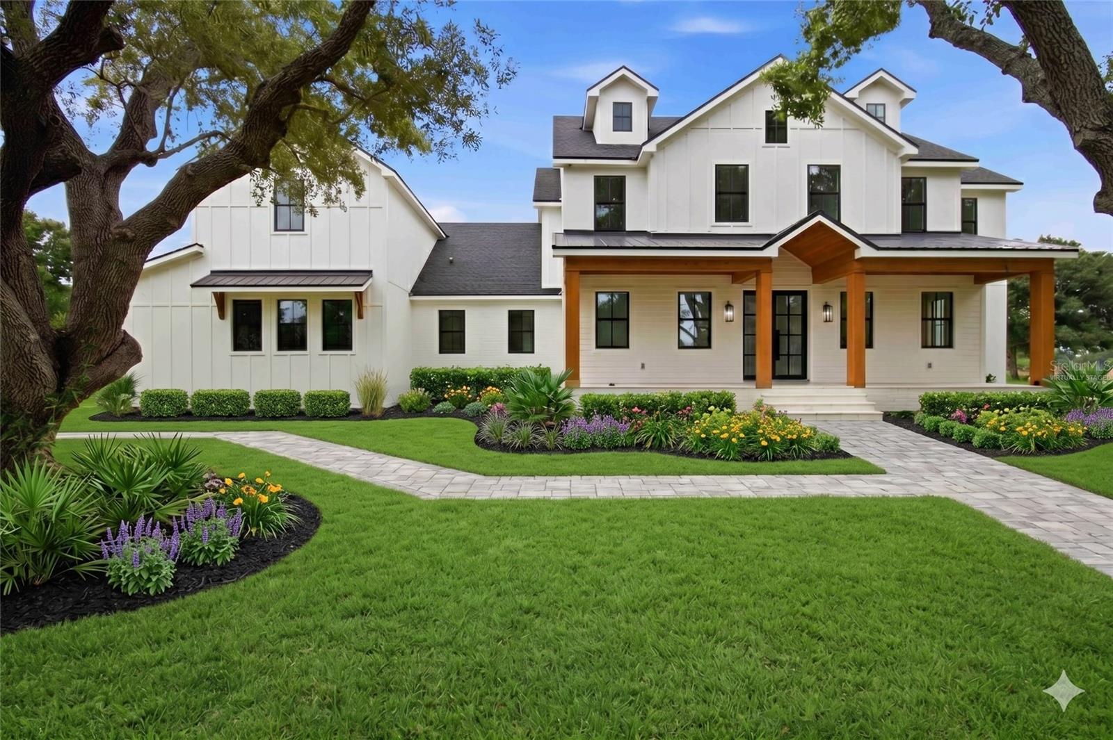 Under Construction. Escape the constraints of master-planned communities without sacrificing proximity or luxury. Masterfully curated by Camlin Custom Homes and JKing Designs, this bespoke 5-acre estate offers the rare luxury of true breathing room with absolutely no HOA restrictions. Zoned OUE1, this private acreage canvas is located just minutes from the premier dining, shopping, and convenience of the Lakewood Ranch area. Spanning over 4,500 SF under air, the architectural design features a soaring two-story great room, a lavish main-level owner’s sanctuary, and a resort-style pool/spa oasis with a custom outdoor kitchen. Skip the typical multi-year custom build stress: completion is approx. 7 months from contract. To save the discerning buyer invaluable time and effort, a flawless, high-end finish palette has already been pre-selected by a professional design team, with select opportunities to customize remaining. Uncompromising quality, space, and convenience.