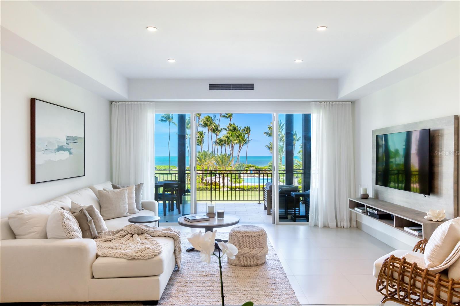 Hidden gem on your new tropical haven beautifully appointed ocean view condominium just-steps away from the beach and the Beach Club, located in the most exclusive residential community in Puerto Rico. The spacious & modern residential unit consists of two bedrooms, and two full bathrooms with extra expansive terrace overlooking the water. Move-in-ready fully furnished and equipped.