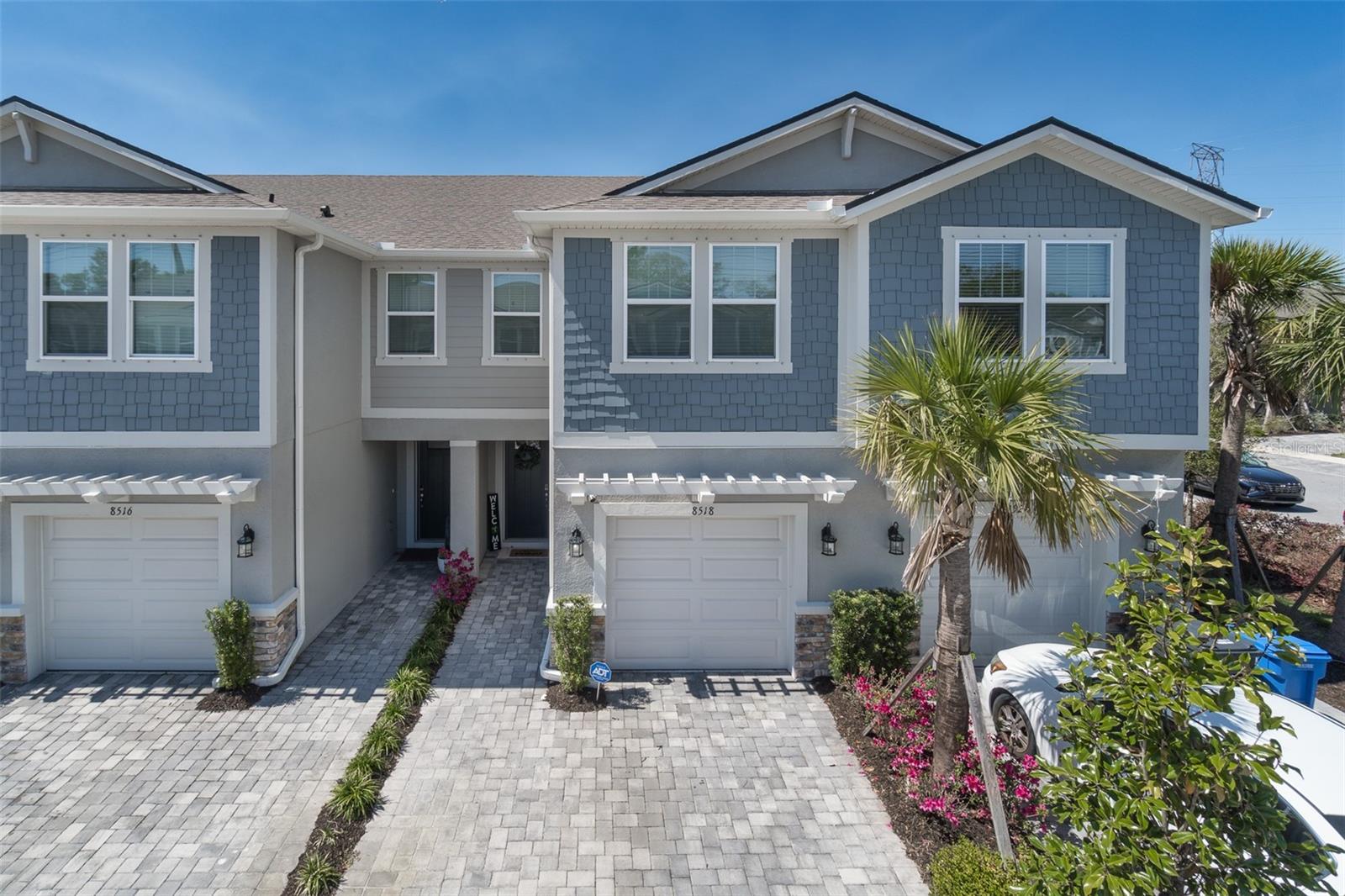 SELLER IS MOTIVATED. Immaculately maintained 2022 townhome in the desirable Citron Grove community of Odessa! This 3-bedroom, 2.5-bath home offers 1,767 square feet of thoughtfully designed living space and a 1-car garage with an epoxy floor. Ideally located near Citrus Park Mall, shopping, dining, Publix, and the Veterans Expressway.

Inside, you'll find an open-concept floor plan with gray ceramic tile throughout the main living areas. The gourmet kitchen features quartz countertops, a large island with pendant lighting, 42-inch upgraded cabinetry, stainless steel appliances, and a spacious walk-in pantry. The kitchen opens to the dining and great room, where triple sliding glass doors lead to a screened lanai with brick pavers overlooking a peaceful nature preserve. A convenient half bath completes the first floor.

Upstairs, a versatile loft provides additional living space, while the spacious owner's suite includes a walk-in closet, two additional closets, and an en-suite bath with dual quartz vanities and a glass-enclosed shower. Two secondary bedrooms share a full bath, and the laundry room is conveniently located on the second level.

Additional highlights include hurricane-rated windows and shutters, a brick-paver driveway, ample guest parking, and a low-maintenance lifestyle in a prime Odessa location.