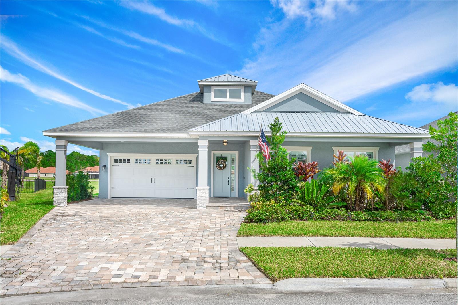 Prepare to be amazed at this Adley built home. Located in the gated Portofino Reserve section in Venetian Bay. The sellers didn't miss a single option when they built this home. Starting with the premium lot that has golf views of the 10th green in the front and the 18th in the rear. This home is on a cul de sac with only 4 homes. The Venetian Bay Country Club is also a few steps away-forget about making dinner tonight! For those cooks, you'll love this kitchen: 6 burner propane stove, Thor appliances, walk in pantry and kitchen island with a granite top. If you need more cooking space, walk through the sliders that collapse and lead to your outdoor kitchen. There is over 1000 sqft of screened in patio. There are plantation shutters on every window.
Plank tile floors through out the home. Plenty of parking under the portico. The two car garage is also oversized and has custom painted floors, and a 100lb ice maker. Storage available in the attic also. Your monthly maintenance fees include landscaping, lawn maintenance, irrigation and sprinkler maintenance as well as weed and pest management. ;Water: City