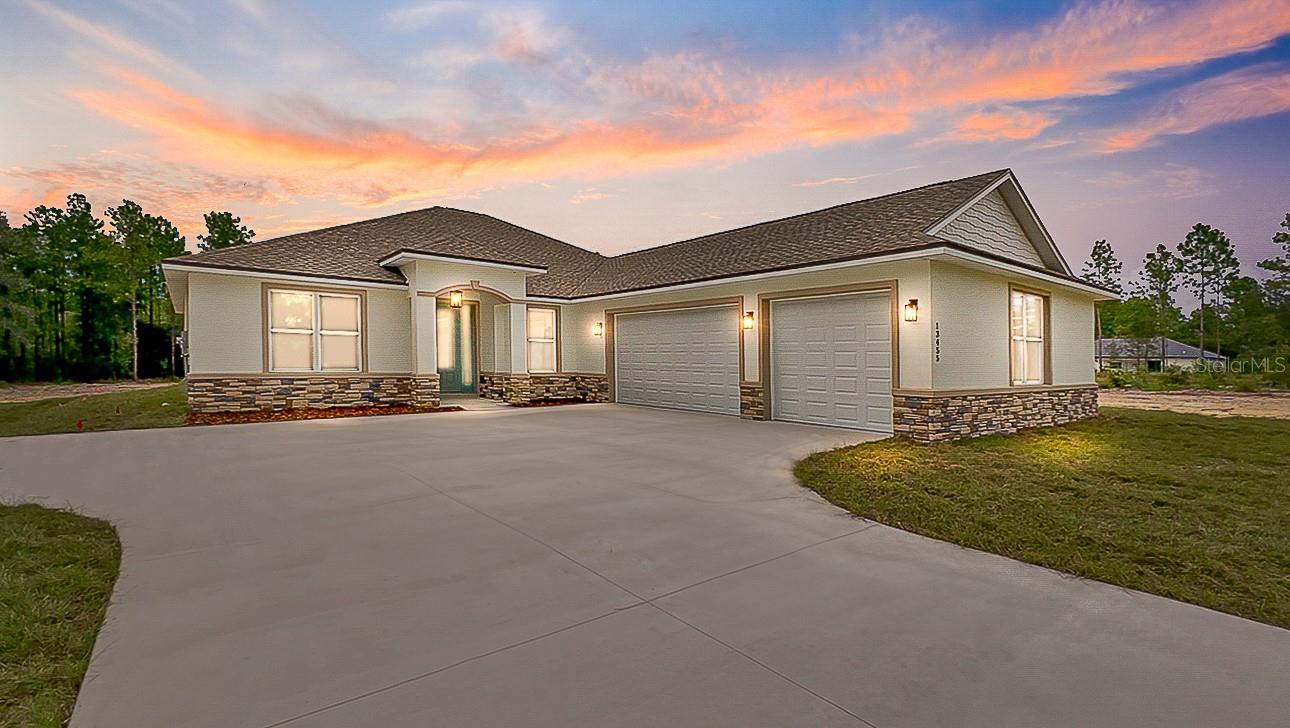 Pre-Construction. To be built. YOUR DREAM HOME STARTS HERE—1.33 ACRE WITH OAK TREES, A TRUE 3-CAR GARAGE & TIME TO PERSONALIZE! Why settle for someone else’s selections when you can build a home that reflects your style? The Haven is a thoughtfully designed pre-construction home offering over 2,600 square feet of beautifully planned living space on a picturesque 1.33-acre Homesite. Designed for the way today’s buyers live, this spacious floor plan features 4 bedrooms, 3 full bathrooms, a dedicated OFFICE with French doors, and a TRUE 3-CAR GARAGE. The open-concept great room flows seamlessly into a chef-inspired kitchen complete with granite countertops, a large center island, stainless steel appliances, 42” soft-close cabinetry, custom backsplash, and premium touches including a range hood and pot filler. The private owner’s retreat offers tray ceilings, dual walk-in closets, an L-shaped dual sink vanity and make up station and an oversized tiled shower with a transom window. A separate guest ensuite with its own bathroom and direct lanai access provides the perfect setup for visitors or multi-generational living, while two additional bedrooms share a beautifully appointed bath. Thoughtful details set The Haven apart, including a CUSTOM MUDROOM, coffee and wine bar, oversized walk-in pantry, spacious laundry room, The expansive covered lanai overlooking your private acreage—perfect for entertaining or simply enjoying peaceful Florida evenings beneath the oaks. For a limited time, buyers can personalize select colors and finishes, creating a home that's truly theirs. Builder requires a Construction-to-Permanent financing or cash escrow options exclusively. Photos are of a previously completed Haven model and includes buyer paid upgrades not included in the base price -stone veneer front elevation accents, luxury plank flooring in the bedrooms, butcher block sitting bench and upper cabinet in mud room, epoxy garage flooring and upgraded appliances.  Don’t just buy a home—create one that’s built around the way you live.