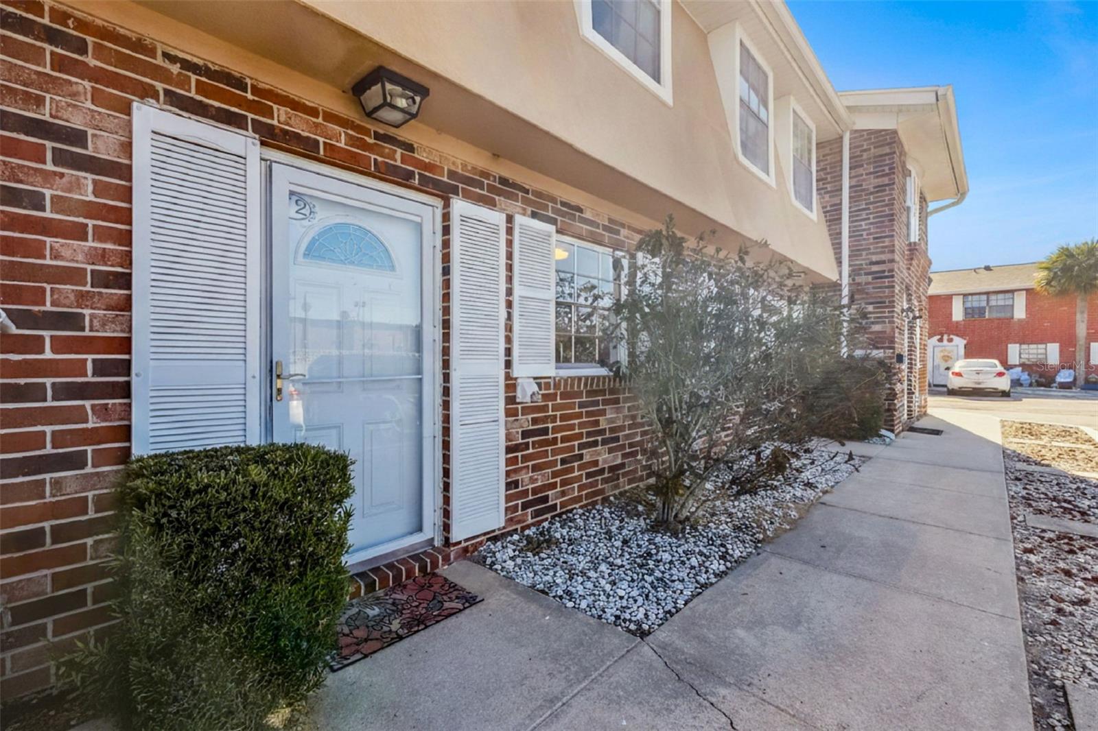 Welcome home to this beautifully updated 2-bedroom, 1.5-bath townhome-style condominium in desirable South Daytona, offering comfort, convenience, and low-maintenance living. As you enter, you're greeted by a light and bright updated kitchen that opens seamlessly to the spacious great room—providing flexible options for both living and dining room layouts. Step through the back doors to your private, fenced patio, an ideal outdoor retreat for relaxing, gardening, or entertaining. A convenient half bath and indoor laundry complete the downstairs interior. Upstairs, you'll find two generously sized bedrooms with a tastefully updated full bath perfectly situated between them. Colonial Townhomes enhance your lifestyle with a beautiful community pool just steps from your patio gate, along with maintained common grounds, water, sewer, trash, exterior maintenance and building insurance included. The community is ideally located across from the Halifax River, with the beach just a 7-minute drive away, and close to shopping, dining, and entertainment options. This would make a great primary residence or fantastic investment property. Seller will consider selling furnished. All information is intended to be accurate but cannot be guaranteed.