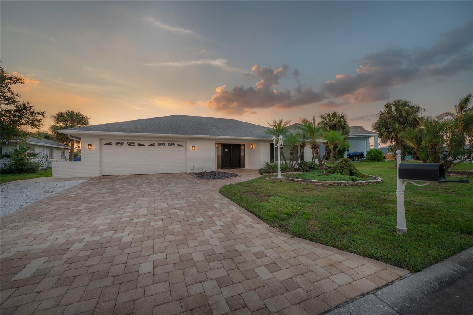 Experience the pinnacle of Florida coastal living in this professionally interior-designed, turnkey masterpiece. Located on a premier deep-water canal with direct access to Tampa Bay, offering the ultimate sanctuary for boaters and luxury seekers alike. Step into your backyard oasis, where the wide, deep-water canal accommodates larger vessels with ease. The property features a newer boatlift, ensuring your craft is ready for sunset cruises at a moment's notice. After a day on the water, retreat to the sparkling screened-in pool, complete with newer pool equipment and a dedicated heater for year-round enjoyment. Inside, no detail has been overlooked. This home has been curated by a professional designer to balance modern elegance with coastal comfort. The heart of the home is the stunning new kitchen, boasting high-end finishes, sleek cabinetry, and premium appliances. Major systems have been updated for total peace of mind, including a newer AC system, allowing you to enjoy the Florida sunshine without the worry of maintenance. Truly Turnkey This property is offered fully furnished, including a fully stocked kitchen. From the designer furniture to the essential cookware, every element has been hand-selected to provide a seamless move-in experience.