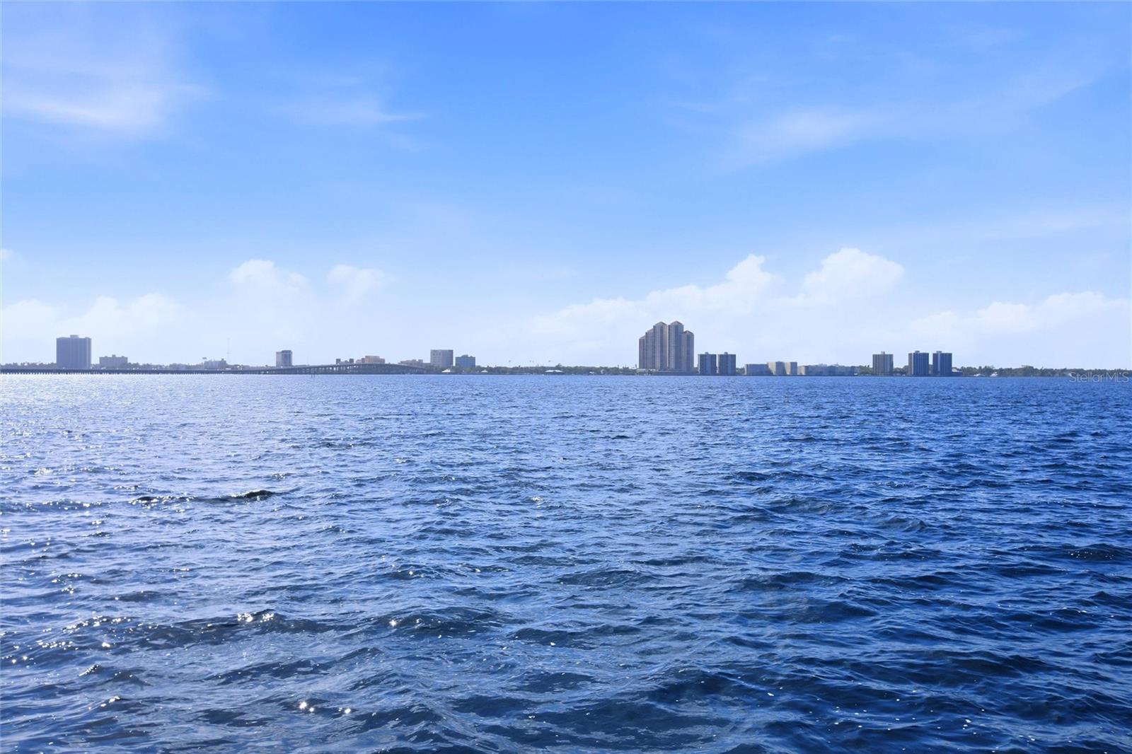 At NO fault to the seller, back on the market for failure to perform. Turnkey ready! Where waterfront living meets effortless comfort, this beautifully maintained fourth-floor condo in Schooner Bay offers the perfect blend of style, convenience, and everyday ease. Overlooking the Caloosahatchee River, this residence delivers a serene setting with views that elevate daily living. Inside, you’ll find a newer kitchen featuring granite countertops, stainless steel appliances, and modern finishes creating a clean, functional space that flows seamlessly into the main living area. The home also offers the added convenience of private in unit laundry, along with a newly updated primary shower, enhancing comfort where it matters most. This condo presents a true turnkey opportunity, perfect for seasonal living or a simplified year round lifestyle. Step onto your private screened balcony and unwind as you take in the peaceful waterfront surroundings. Residents of Schooner Bay enjoy access to a heated community pool, tennis courts, fitness center, fishing pier, dock and beautifully maintained grounds, all within a secure, amenity rich environment designed for relaxed or active Florida living. This home delivers a lifestyle centered around comfort, convenience, and the beauty of the water. Condo staged for photos, currently vacant and empty, Ready for the next owner!