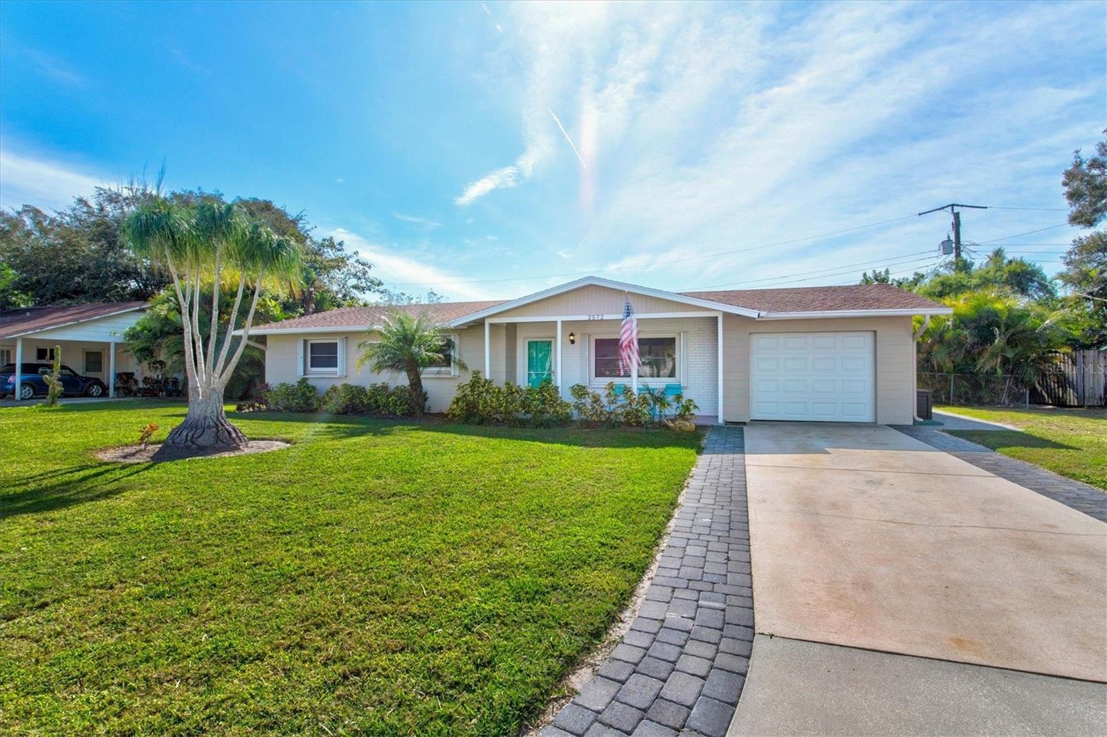 This TURN-KEY sought-after CITY LIMITS gem is situated on a large 0.22 acre lot with an oversized 1 stall garage! Step inside this beach inspired, open concept beauty that is filled with natural Southern exposed light. Luxury vinyl flooring flows throughout, while the well-appointed kitchen features quartz countertops and stainless steel appliances, perfect for both everyday living and entertaining. The French doors invite you to a private fenced backyard retreat that boasts a new heated sun-shelf pool with an expansive paver deck to lounge. Recent updates provide you with peace of mind! Accordion shutters and a new electrical service have been installed. No cast iron here! Plumbing and supply lines have been replaced! Weekly rentals are allowed so don't miss this TURN-KEY opportunity within the City Limits! This home serves as the prime gateway to a vibrant, active lifestyle with a wide array of local amenities right at your fingertips! Arlington Park's walking trails, basketball, tennis, outdoor fitness stations, and the aquatic center are all within half a mile! The beaches, downtown, arts, dining scene and highly rated schools are only minutes away – all within one of the most desirable City limit’s neighborhoods, and no HOA fees!!!