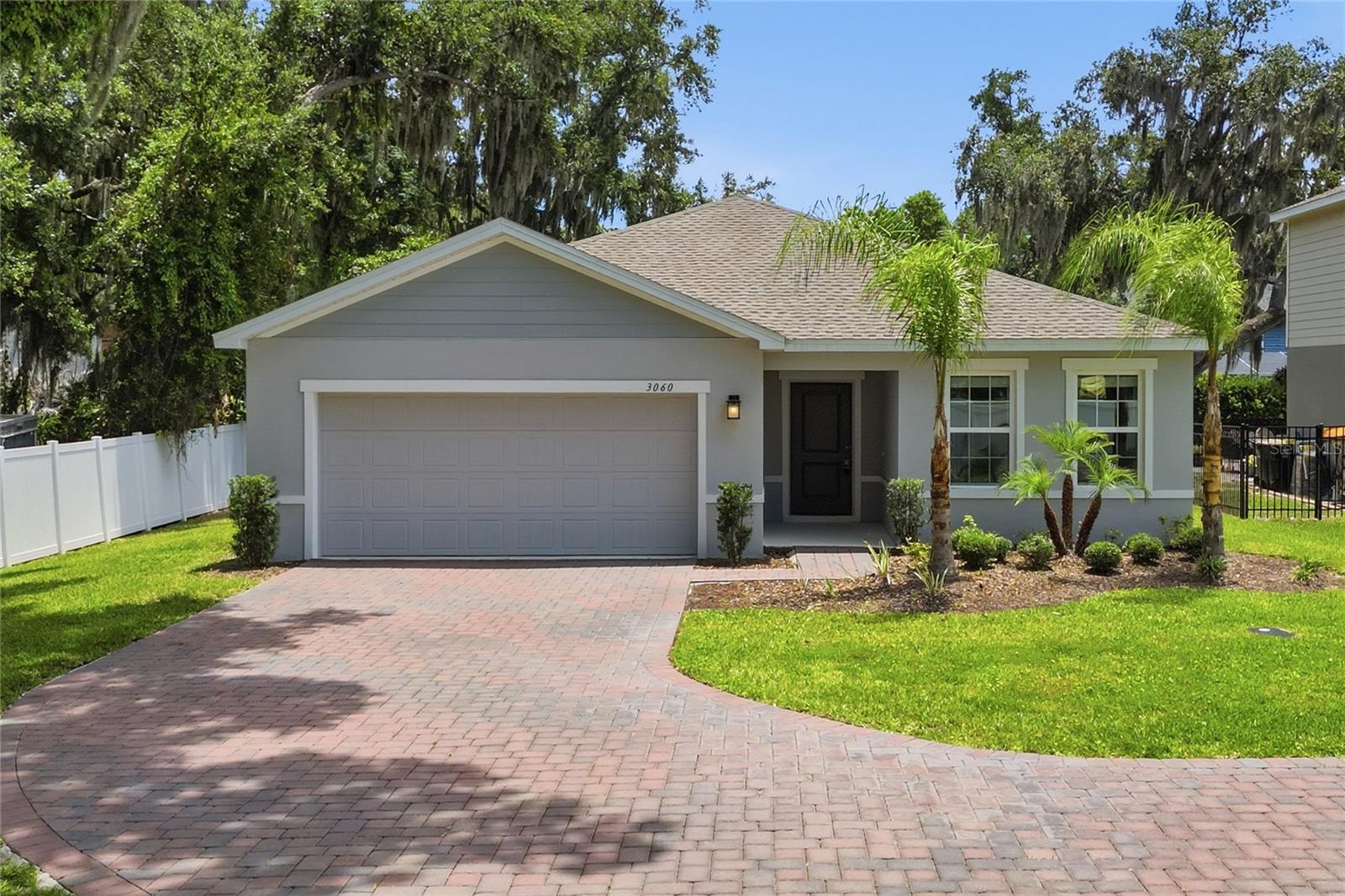 Welcome to 3060 Royal St, a beautiful 2023-built home located in the desirable Southeast Winter Haven area near the Chain of Lakes. This 4-bedroom, 2-bath home offers a comfortable open layout, modern finishes, and a 2-car garage. One of the standout features of this property is its canal location, with the canal connecting Lake Winterset and Lake Eloise, creating the perfect backdrop to enjoy the Winter Haven Chain of Lakes lifestyle. Situated on a desirable corner lot, this home also features a curved paver driveway, professional landscaping, and great curb appeal from the moment you arrive. Inside, the kitchen features granite countertops, stainless steel appliances, a center island with breakfast bar, and plenty of cabinet and counter space. Sliding glass doors bring in natural light and lead to the lanai, perfect for relaxing, or entertaining. Additional features include an irrigation system, indoor laundry closet, ceiling fans with lights, 2-inch faux wood blinds, and smart Wi-Fi enabled garage door opener and thermostat. Conveniently located near shopping, dining, schools, Legoland, and area lakes, this home is a great opportunity for buyers looking for comfort, newer construction, and a special waterfront setting in one of Winter Haven’s most loved areas.