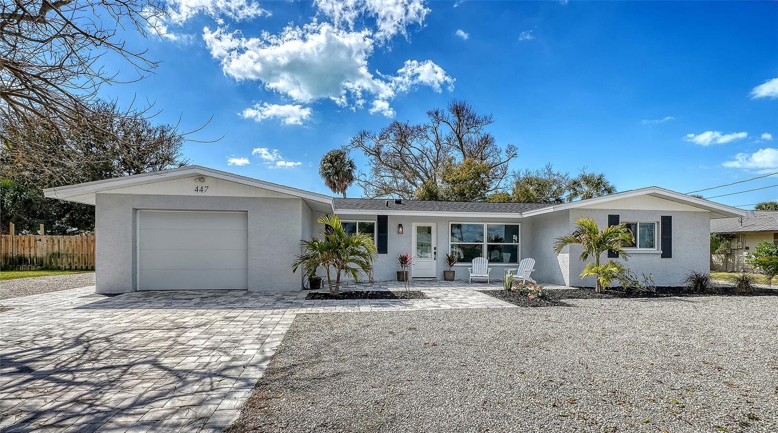 Classic and cool, this Sorrento Shores beauty blends true Old Florida charm with all the modern updates you actually want, perfectly positioned West of the Trail near the sparkling Intracoastal Waterway. What’s been at the top of your list — move-in ready, a spacious lot, no flood zone, boat/RV parking, optional low HOA, no CDD fees, community marina access, an A+ school district, or quick access to beaches and dining? The good news? You don’t have to choose. This home truly checks every box.

Inside and out, everything has been thoughtfully renovated since 2022, including a new roof (2023 w 25yr warranty), septic, central air, impact windows and doors (with the exception of the Florida room), updated electrical panel, irrigation equipment, soffits, water heater, impact garage door, pavers, and beautifully redesigned kitchen and baths. Luxury vinyl plank flooring runs throughout, complemented by fresh paint and abundant natural light. The split floor plan provides privacy, while the open living spaces make everyday living and entertaining effortless.

The kitchen is both functional and inviting, featuring shaker cabinetry, quartzite countertops, stainless steel appliances, a generous island, and a charming coffee bar that flows seamlessly into the family room and dinette. One of the standout features is the 336-square-foot air-conditioned sunroom with pocket sliders — incredible flex space for a home office, gym, playroom, or second living area — all overlooking the expansive backyard. The screened lanai and paver patio create easy indoor-outdoor living year-round. The only real decision left? Whether you’ll sip coffee on the welcoming front porch as neighbors pass by or unwind in your private backyard oasis listening to the whispering waves.

Sorrento Shores is just minutes from Nokomis Beach (4 miles) and Venice Beach (6.5 miles), close to Oscar Scherer State Park and the Legacy Trail (1.5 miles), near the renowned Pine View School (2.9 miles), with convenient access to I-75, historic City of Venice (5.5 miles) and vibrant downtown Sarasota (12 miles). Here, functional updates, classic charm, location and lifestyle all come together — schedule your showing today!