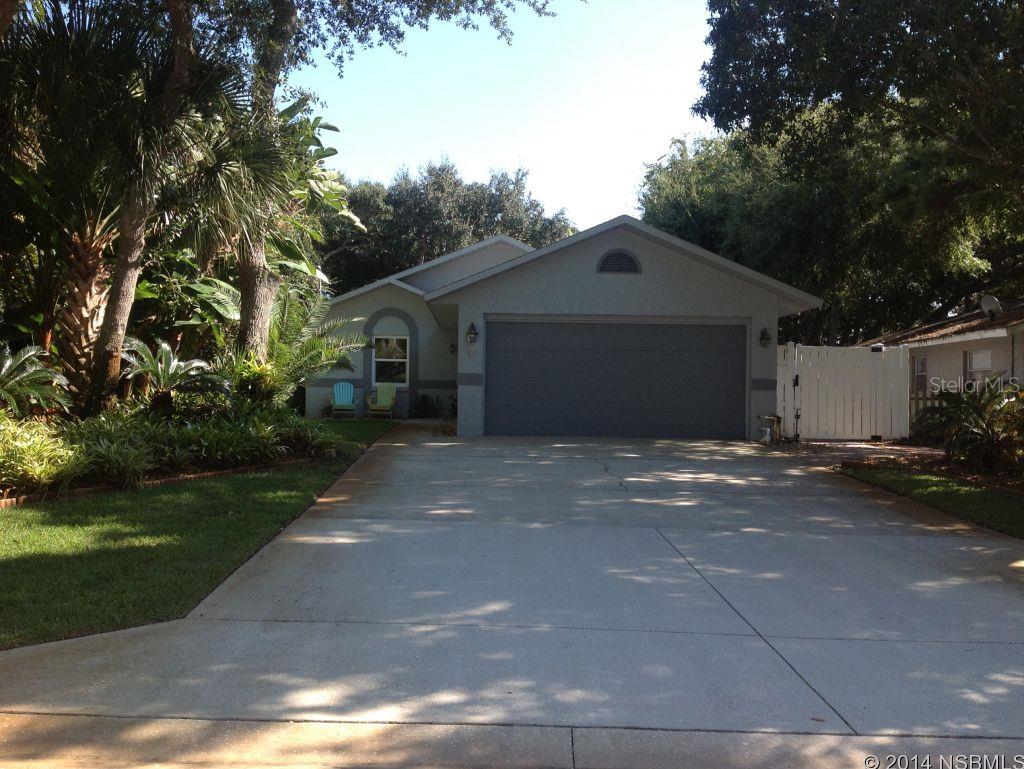 1/2 Block to the Beach!  Beautiful well maintained home with lots of amenities.  Tiled throughout, soaring vaulted ceilings with skylights, large pass thru window from kitchen to dining area,  fireplace, split bedroom plan, French doors leading to porch.  Pavers in large area of back yard mean less yard maintenance.  Outside shower. Double paned and wind rated windows.  Kitchen has granite countertops with stainless appliances.   Double car garage.  Lovely manicured yard with irrigation system.  This home truly shows pride of ownership.  A must see! ;Water: City