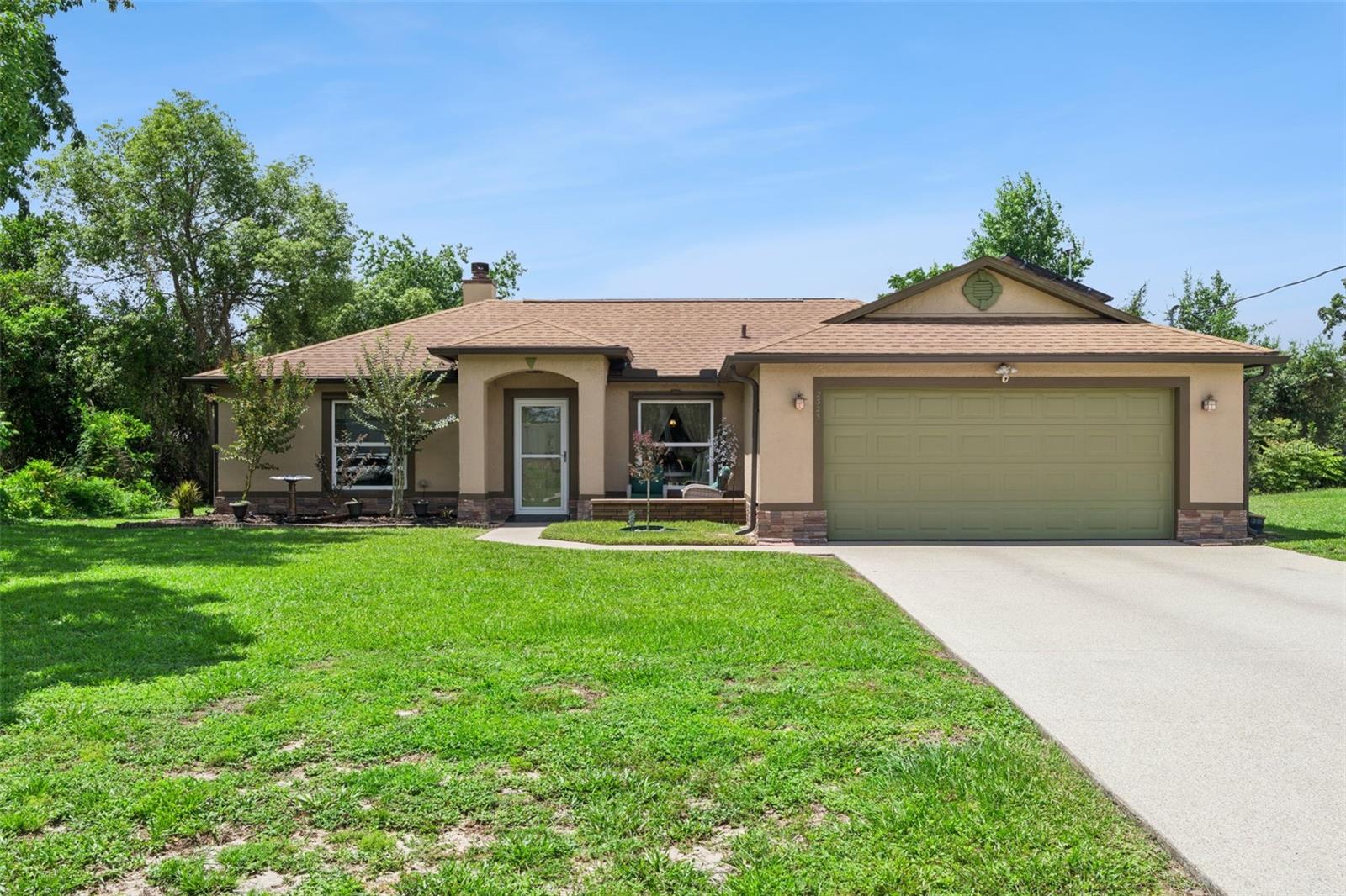 Welcome to this beautifully upgraded and meticulously maintained home offering exceptional value, modern comfort, and energy-efficient living in a quiet Deltona neighborhood with no HOA. Thoughtful improvements inside and out create a refined living experience rarely found at this price point.
The exterior impresses immediately with a Zano521 industrial concrete–coated driveway, engineered wood deck with railing and ADA ramp, front sitting porch added in 2026, hurricane-rated garage door, hurricane shutters for all major windows, double-paned windows, gutters installed in 2022, and a roof replaced in 2016. The home also features a fully paid-off solar system with 17 years of warranty remaining, delivering outstanding long-term energy savings, plus a 30-amp/110-volt RV plug for added convenience.
Inside, the inviting layout is filled with natural light and comfortable living spaces. The kitchen includes upgraded counters installed in 2015, and new ceramic tile flooring installed in 2026 in the living area, kitchen, and back bedroom, with a 5-year manufacturer warranty. Both bathrooms feature Bath Fitter shower systems for durability and easy maintenance. A whole-house water purifier (2025) enhances everyday comfort. Mechanical updates include AC (2014) and a water heater (2014), offering peace of mind for years ahead.
The fully fenced backyard is perfect for outdoor living, complete with an expansive deck ideal for gatherings, grilling, or relaxing in the Florida sunshine. The property provides excellent functionality with ample parking, accessibility features, and energy-efficient upgrades throughout.
Conveniently located near shopping, dining, parks, schools, and major roadways, this home combines thoughtful improvements, low operating costs, and everyday comfort — a rare opportunity in today’s market.