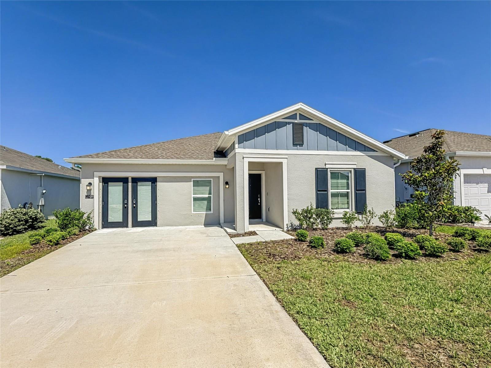 One or more photo(s) has been virtually staged. **Rates in the Mid to Low 5s - A unique incentive is now available on this property**
Sales center will be converted back into a garage prior to closing.

Why wait to build when you can own this never-occupied former model home in the peaceful community of The Parks at Edgewater, offering serene pond views and no rear neighbors. 

Thoughtfully designed with both comfort and elegance in mind, this beautifully appointed home features an open-concept floor plan centered around a spacious family room, perfect for everyday living, relaxing evenings, and entertaining guests. The adjoining dining area creates an inviting space for family meals and special gatherings alike.

The chef-inspired kitchen seamlessly blends style and functionality, showcasing 42” cabinetry, quartz countertops, stainless steel appliances, abundant prep space, and a large center island with seating — ideal for hosting or casual dining.

Designed as a private retreat, the spacious owner’s suite offers ample room for a cozy sitting area by the window, along with a large walk-in closet and a luxurious ensuite bath. The spa-inspired bathroom features a walk-in shower with designer wall tile and an elegant quartz-topped vanity.

Two additional guest bedrooms and a full guest bath provide flexibility for family, visitors, or a dedicated home office.

Sliding glass doors open to the outdoor patio and backyard with no rear neighbors, offering the perfect opportunity to create your own private outdoor oasis, entertaining space, or fenced play area for children and pets.

Residents of The Parks at Edgewater enjoy access to community amenities including a tot lot, dog park, and sports courts, delivering something for every stage of life. Conveniently located near the beautiful Volusia County Beaches, world-class fishing along the Indian River, and the breathtaking Canaveral National Seashore, this community offers endless opportunities for coastal living, outdoor recreation, and nature-filled adventures.