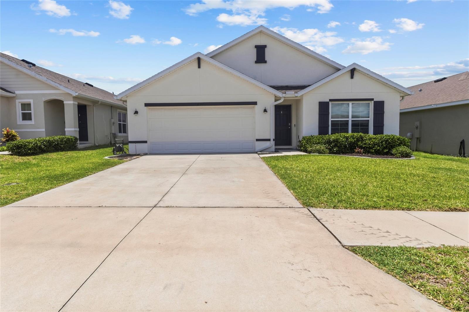 Welcome to Abbott Park, where modern design, smart-home technology, and everyday comfort come together in the heart of Zephyrhills. Built by D.R. Horton in 2021, this beautifully maintained 4-bedroom, 2-bathroom home with a 2-car garage offers the benefits of newer construction without the wait.

Residents enjoy an impressive collection of community amenities, including a resort-style pool overlooking the water, clubhouse, playground, scenic lake, dog park, and walking areas designed to encourage both relaxation and a strong sense of community.

Inside, the thoughtfully designed split-bedroom floor plan provides privacy and functionality. Neutral tones, recessed lighting, and an open-concept layout create a bright and welcoming atmosphere. The spacious family room flows seamlessly into the kitchen, making it ideal for entertaining and everyday living. Sliding glass doors lead to a covered lanai, extended patio, and a large vinyl-fenced backyard—perfect for outdoor gatherings, pets, or play. An additional living space offers flexibility for a home office, sitting area, or playroom, while the interior laundry room adds everyday convenience.

The kitchen combines style and practicality with rich cabinetry, granite countertops, a decorative backsplash, stainless steel appliances, a closet pantry, and a breakfast bar perfect for casual dining and conversation.

Privately situated at the rear of the home, the primary suite serves as a peaceful retreat featuring a spacious walk-in closet and an en-suite bath with dual vanities and a large walk-in shower. The secondary bedrooms provides comfortable accommodations and share a full bathroom with a tub/shower combination.

Designed with the future in mind, Abbott Park features community-wide high-speed internet, integrated smart-home technology, and solar-powered streetlights, creating a connected and energy-efficient neighborhood.

Conveniently located just off U.S. Highway 301, this home offers easy access to Tampa, Wesley Chapel, Lakeland, and Orlando, placing shopping, dining, entertainment, healthcare, and recreation within easy reach.

Don't miss this opportunity to own a move-in-ready home in one of Zephyrhills' most desirable growing communities. Offering modern features, exceptional amenities, and a prime location, this home delivers the lifestyle today's buyers are looking for. Schedule your private showing and discover why this one feels like home the moment you arrive.