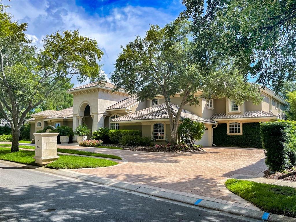 Under contract-accepting backup offers. Welcome to your new home! One of the largest residences in the guard-gated Bayou Club community showcases a stunning stone exterior with arched details, unobstructed
views of the infinity edge pool, and a tranquil pond panorama that wraps around the home. Upon entering through the custom vaulted glass door, you will be welcomed by an
abundance of natural light, facilitated by tall ceilings and 10-foot Iron glass French doors. Meticulous woodwork and "smart" home features further amplify the grandeur and
charm of this masterpiece. The primary suite on the main level is a personal sanctuary and features custom built-ins, a gas fireplace, and French doors leading to your outdoor
oasis.  The open floor plan kitchen offers a natural gas Viking range, double Wolfe ovens, hand-painted faux wood cabinets, two separate subzero refrigerators, pull-out
freezers, a separate ice maker, and a hidden walk-in pantry. The main level adds a spacious family room and a large media/game room.  Every upstairs bedroom features its
own ensuite bath with a walk-in closet. The addition and renovation by renowned builder Carmine Pici treated the entire house including an epic 350 square foot primary
closet with custom LED underlit rods, plus a study that features coffered ceilings, raised panel walls, leather flooring, custom woodwork by Michael Bright, and exquisite
peaceful water views. Especially spectacular is also the hidden room where the walls swivel by Hafele pivot doors. The home has an undeniable charm and richness throughout.  The owner will also consider selling the home fully furnished with custom high-end designer furnishings. 
 A full detailed list of all this property has to offer is available
upon request. Call and reserve your showing today!