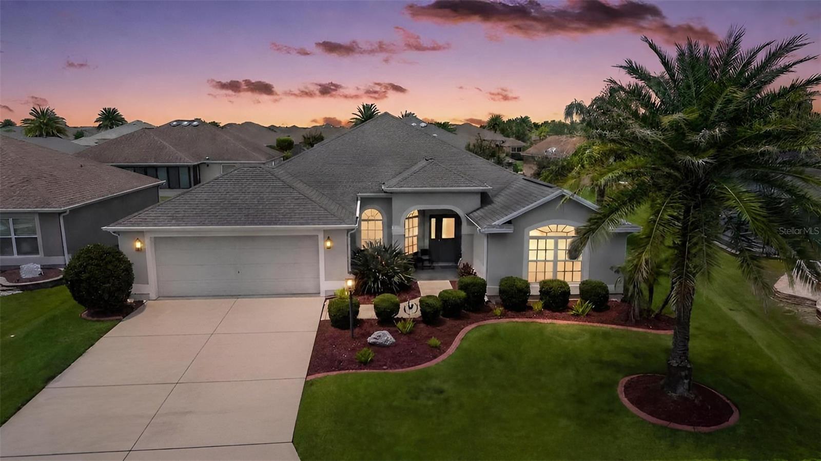 STUNNING, 3/2 BLOCK and STUCCO, designer STRETCHED GARDENIA featuring a GLASS-ENCLOSED LANAI with MATURE PRIVACY LANDSCAPING, GUTTERS AND DOWNSPOUTS, and ROOM FOR A POOL/SPA in the highly desirable Village of Hillsborough! JUST MINUTES to Brownwood Paddock Square with shopping, dining, and live nightly entertainment! TROPICAL landscaping with STONE beds and CURBED edges, ARCHED entry vestibule, and LEADED-GLASS door with sidelight and transom welcome you in to the GENEROUS foyer of this METICULOUSLY-MAINTAINED home! The INCREDIBLE kitchen is a culinary haven boasting TILE flooring, STAGGERED GLASS-ACCENTED CHERRY WOOD cabinetry that exude warmth and timeless elegance, GRANITE countertops, STAINLESS appliances with slide-in range, ROLL-OUT shelving, built-in PANTRY, EAT-IN breakfast bar, and an adjoining dinette nook with TWO BAYED arched windows - perfect for casual dining. HIGH VAULTED ceilings and an OPEN CONCEPT layout of the living and dining rooms produce a bright, SPACIOUS area filled with natural light, highlighted by a SKYLIGHT in the living room and showcasing RICH wood-toned ENGINEERED-HARDWOOD flooring.. From these rooms, FOUR-PANEL sliding glass doors create a seamless transition to the EXPANSIVE ENCLOSED LANAI, adding approximately 270sf of additional living space! Complete with a painted floor and two ceiling fans, this inviting retreat is the perfect setting for morning coffee, evening cocktails, or relaxing with family and friends! Just beyond, the adjoining REAR PATIO offers an ideal space for grilling and outdoor dining, while the SPACIOUS yard provides ample ROOM FOR A FUTURE POOL. Surrounded by MATURE REAR PRIVACY LANDSCAPING, this PEACEFUL OUTDOOR OASIS offers EXCEPTIONAL PRIVACY in a secluded setting! Returning indoors, the primary suite features a fabulous TRAY ceiling and TWO SPACIOUS WALK-IN closets. Its beautifully-appointed en suite bath features CHERRY WOOD cabinetry with TWO individual vanities, GRANITE countertops, TILED WALK-IN ROMAN-STYLE shower, built-in LINEN closet,  and SEPARATE water closet. A SPLIT floor plan places two additional bedrooms and second bath near the front of the home behind a POCKET DOOR forming a SECLUDED wing and ensuring plenty of PRIVACY for guests and/or a home office. Bedroom two showcases a VAULTED ceiling, DOUBLE windows with arched transom, and built-in closet. The second bathroom offers a CHERRY WOOD vanity with GRANITE top, TILED tub and shower combo, and hall LINEN closet. A third bedroom has a VAULTED ceiling and built-in closet. The centrally-located INTERIOR laundry room features a TILE floor, CHERRY WOOD cabinetry, shelving, and a built-in utility sink with GRANITE top. The OVERSIZED 24’x24’ TWO-CAR GARAGE boasts a PEGASUS water filtration system and AMPLE room for parking and storage! DON’T MISS YOUR OPPORTUNITY TO MAKE THIS GORGEOUS HOME YOUR OWN! The Village of Hillsborough is IDEALLY LOCATED - JUST MINUTES to Brownwood Paddock Square! Close to Hillsborough, Bradenton,  and Manatee Neighborhood Recreation Centers; Eisenhower Regional Recreation Center; Palmetto, Sweetgum and Mangrove Executive Golf Courses; Evans Prairie Championship Golf Course and Country Club; CR 466A with Colony Shopping Plaza and a plethora of shopping, dining, banking, medical, and more! PLEASE WATCH OUR WALKTHROUGH VIDEO of this EXCEPTIONAL HOME in an AMAZING LOCATION, and CALL TODAY for your private showing or virtual tour!