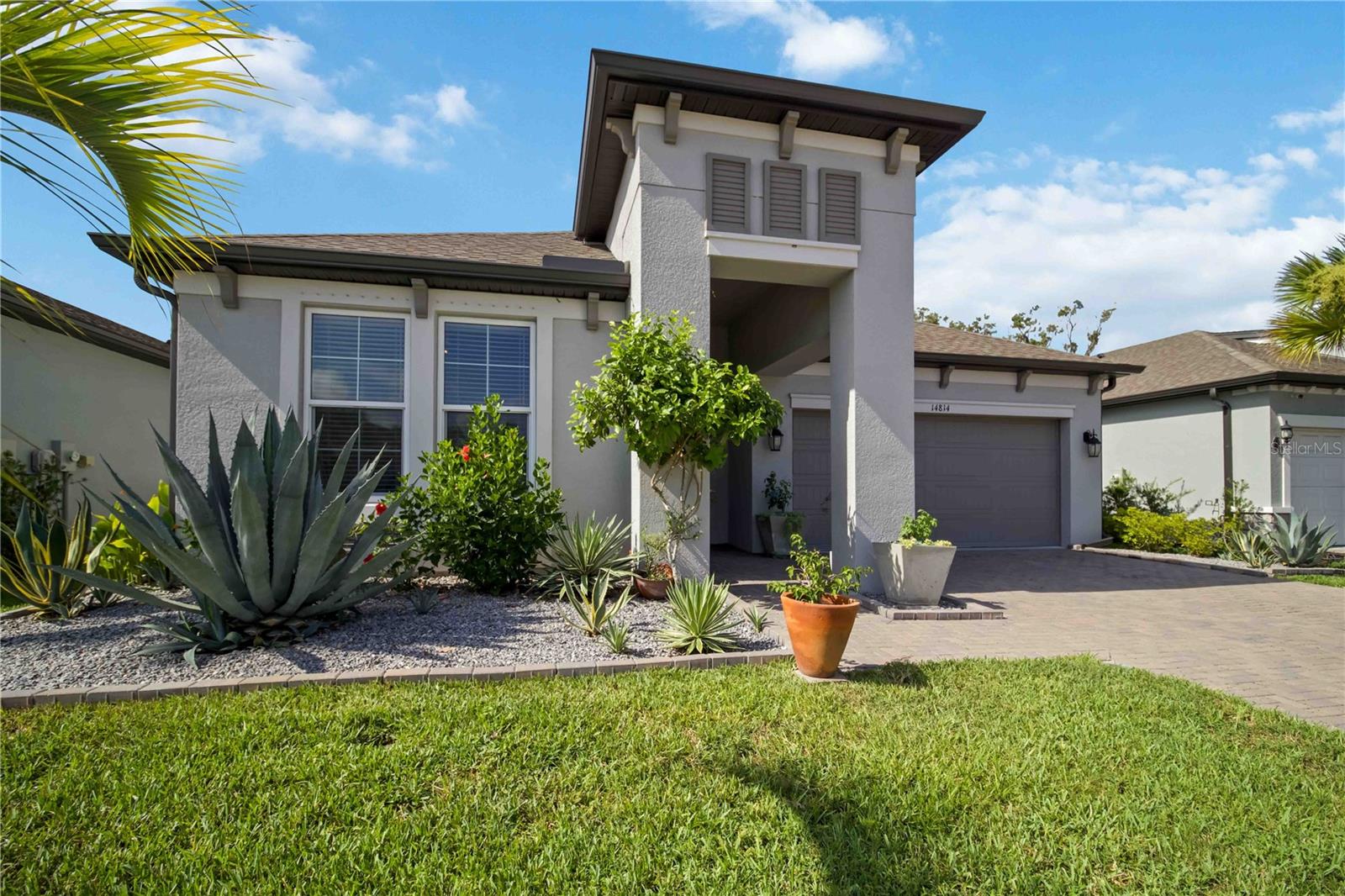 More than a beautiful home, 14814 Sora Way, located in the exclusive private gated community of Riverside Preserve, offers a Florida lifestyle like no other community. 
This home is luxury without the wait—a better than new 2022 M/I Homes Spinnaker with premium upgrades already completed. Offering 3 bedrooms, 2 baths, and 1,873 square feet of thoughtfully designed living space, this beautifully maintained home showcases 10-foot ceilings, several tray ceilings, crown molding, 8-foot panel interior doors, matte black hardware, and 8-foot triple sliding glass doors with screens that seamlessly connect indoor and outdoor living.
The gourmet kitchen is a chef's dream, featuring GE Profile appliances, a convection wall oven and convection microwave, touch-control induction cooktop, upgraded 3 tier dishwasher, Cambria quartz countertops, designer tile backsplash, 42-inch shaker cabinetry with crown molding, soft-close large deep drawers, and a spacious walk-in pantry. The private owner's suite provides a spa-inspired retreat with dual vanities, an oversized custom rain shower, upgraded tile, and a generous walk-in closet with an additional linen closet for storage.  Two additional large bedrooms with ample closets will accommodate guests or can be used as an office or den.
The second bathroom features large vanity with quartz countertop, tub and shower with beautiful, upgraded tile and a large linen closet.
Step outside to an extended under roof lanai with outdoor ceiling fan, lighting, and roll-down shades. The extended area is complete with a custom pergola and extends your outdoor living area - perfect for entertaining, grilling, or simply enjoying Florida's year-round sunshine in comfort.
Additional premium features include an upgraded laundry room with an LG Laundry Tower, with upper and lower cabinets for plenty of storage with quartz countertop for folding laundry, in-wall pest control, gutters, Clare Video doorbell with security camera wiring, epoxy sealed garage floor, Kevlar hurricane shutters for windows and slider, and professionally landscaped grounds.
Nestled among just over 100 homes, this intimate neighborhood offers residents private access to a spectacular 16-acre preserve along the scenic Manatee River. You can store your kayak or canoe right on the premises to take advantage of all the Manatee River has to offer. Enjoy kayaking, canoeing, paddleboarding, fishing, peaceful walking paths, picnic and grilling areas, and the River House—a beautiful riverfront gathering place where residents can host private celebrations, special occasions, and community events. Whether you're watching the sunset over the river, launching your kayak at sunrise, or gathering with friends for an evening by the water, every day feels like a getaway. It's the perfect blend of recreation and relaxation that makes Florida living so special.
Ideally located just minutes from Lakewood Ranch, Waterside Place, University Town Center, I-75, championship golf, exceptional dining, shopping, top-rated medical facilities, and the award-winning Gulf Coast beaches, Riverside Preserve offers the perfect balance of peaceful nature and everyday convenience.
Offering a riverfront lifestyle without the maintenance of waterfront ownership, exclusive access to the Manatee River and River House, and the quality and peace of mind that only a better-than-new home can provide, 14814 Sora Way delivers the very best of Florida living in one exceptional property.