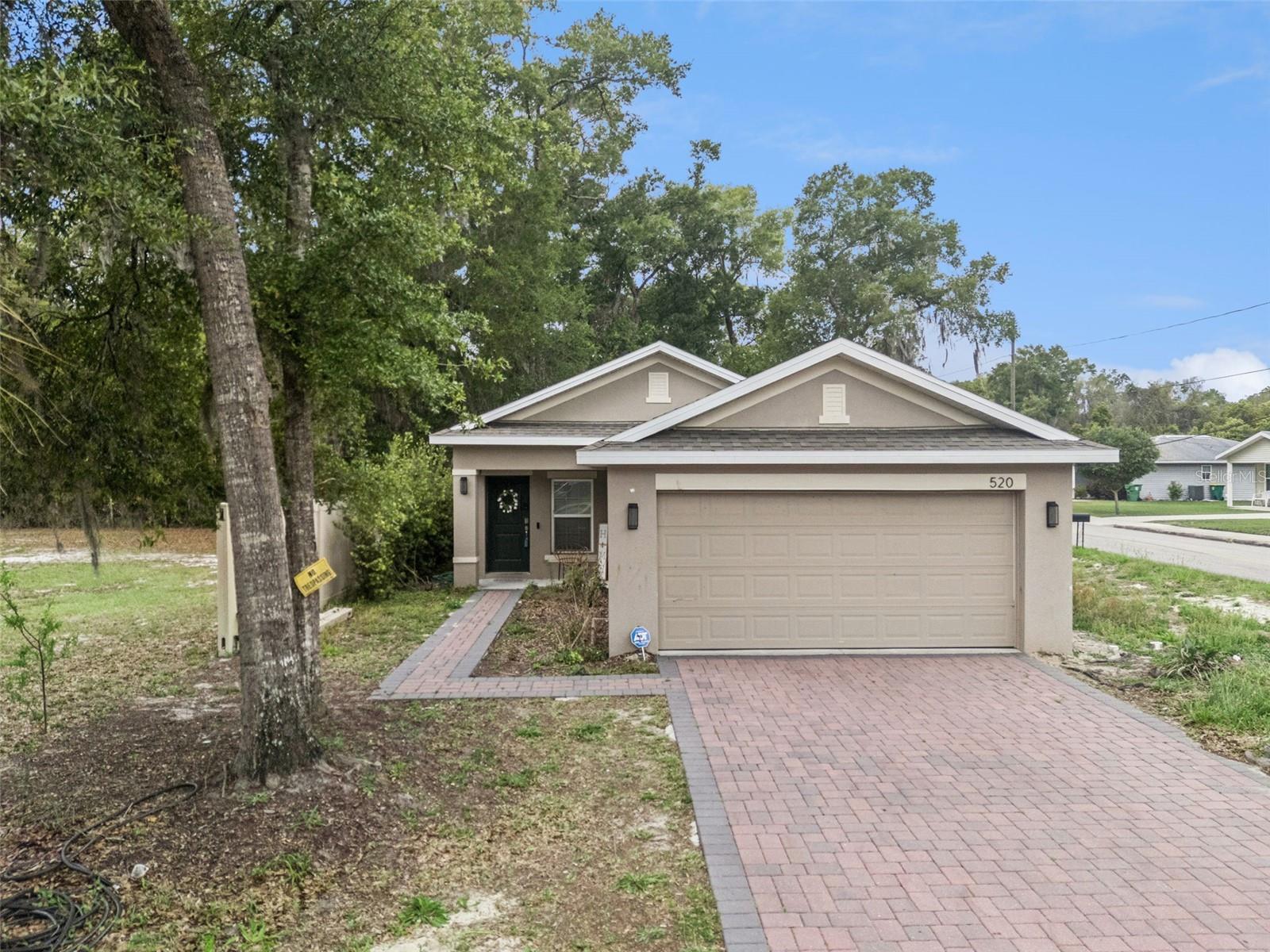 Single-story home ideally located just minutes from historic Downtown DeLand and close to Stetson University! This beautiful 3-bedroom, 2-bathroom home offers a spacious open-concept layout designed for comfortable living and entertaining.As you step through the front door, you’re welcomed by an impressive view of the main living area, featuring an open dining space, a stylish kitchen with a very large island, and a bright living room with sliding glass doors leading to the back patio. The primary suite is privately situated just off the living room and includes its own sliding glass door with direct outdoor access. The ensuite bathroom features a double vanity, a huge walk-in shower, and a generously sized walk-in closet. On the opposite side of the home, the two additional bedrooms are thoughtfully positioned with a full bathroom in between, complete with a shower/tub combo. Additional highlights include a dedicated laundry room, a 2-car garage, high ceilings, and beautiful crown molding throughout. Built in 2021, this home combines modern construction with stylish finishes in a fantastic location. Currently tenant occupied on a month-to-month lease. For investors, the current tenants have expressed interest in signing a new 12-month lease, offering a potential opportunity for immediate rental income.