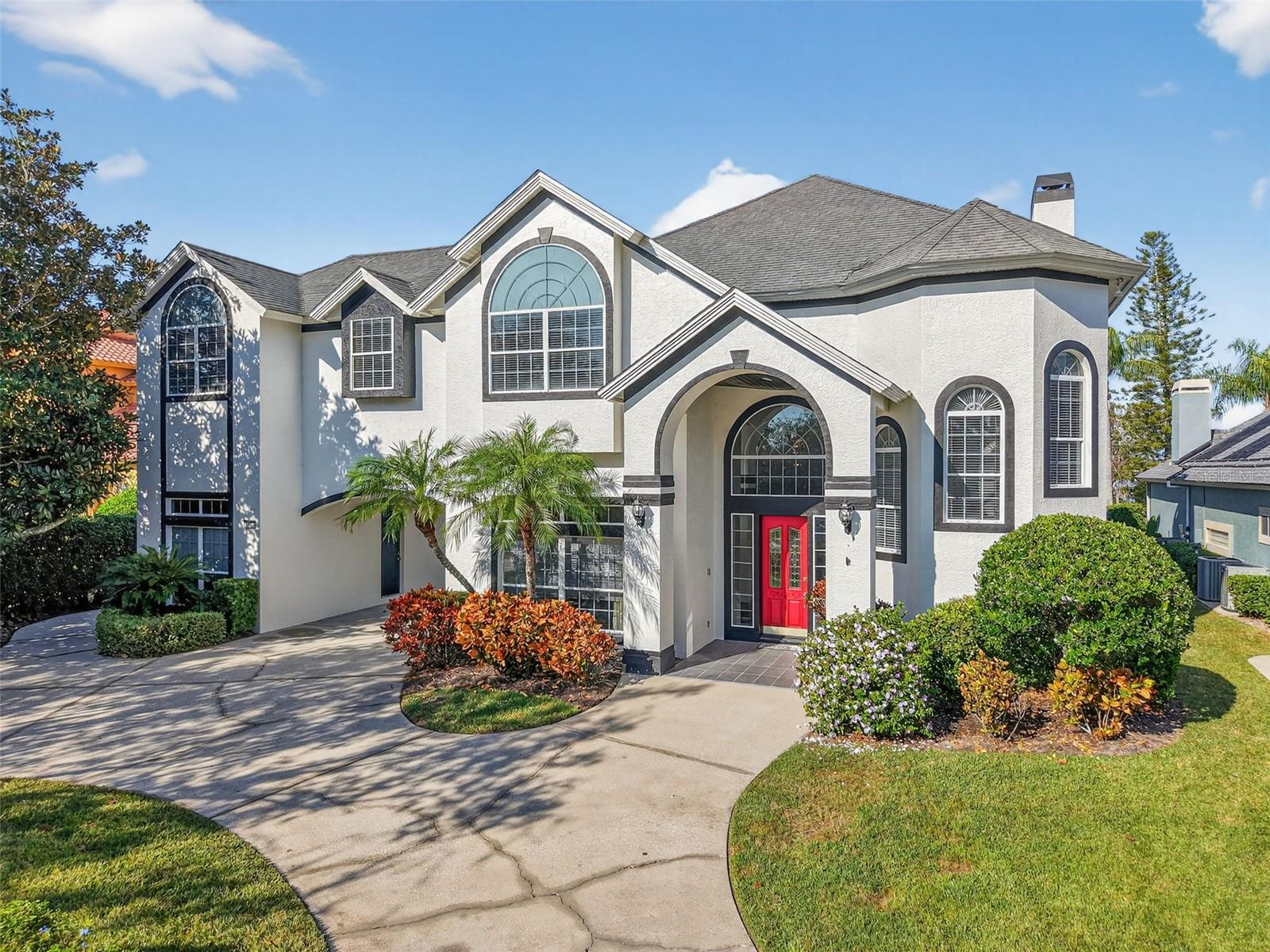 Short Sale. Amazing lakefront pool home set on nearly one-acre lot on Loch Leven in Mount Dora, where wide-open water views, glowing sunset skies, and direct lake access from a private covered dock with lift create a setting that defines Central Florida waterfront living. With over 5,500 square feet, this dock and pool home offers 5 bedrooms, a private office with built-ins, loft, hidden bonus room, spa, and outdoor summer kitchen—blending space, functionality, and a lakefront lifestyle in The Country Club of Mount Dora near Tavares and Eustis.

Positioned within The Country Club of Mount Dora, this lakefront property captures open water views from main living areas, creating a constant visual connection to the pool, dock, and lake. From the entry, natural light and extended sightlines draw you through formal living and dining spaces toward the rear of the home where the water becomes the focal point.

The kitchen and family room are oriented toward the lake, designed to keep outdoor living in view. Features include a center island, granite counters, walk-in pantry, breakfast bar, and multiple prep areas, supporting both daily use and entertaining. Large openings connect interior spaces to the pool deck, reinforcing the indoor-outdoor flow expected in a Florida lakefront home.

The main-level primary suite faces the water and includes two walk-in closets, built-in features, and an en-suite bath with split vanities, soaking tub, and separate shower.

The second level includes four additional bedrooms with walk-in closets and Jack-and-Jill bath layouts, along with a spacious loft functioning as a secondary living area. A hidden bonus room provides flexible space for media, office, or storage.

Outdoor features include a private pool and spa, paver deck, covered seating areas, and a summer kitchen designed for extended outdoor use. The covered dock with lift provides direct access to Loch Leven for boating, fishing, and lakefront living. Nearly one-acre lot allows for additional space and separation while maintaining functional waterfront access.

Located near Downtown Mount Dora with shops, restaurants, and seasonal events, and close to Tavares waterfront along Lake Dora and Eustis parks and recreation. Golf community amenities include clubhouse, tennis courts, pool, restaurant, and sidewalks. Convenient access to US-441, SR-46, and surrounding Central Florida areas.

All offers must go through the short sale process with the seller’s lender for approval or denial. Buyer to verify all measurements, square footage, HOA details, and timelines. Schedule a showing to experience the lake views, dock access, and outdoor living this property offers.