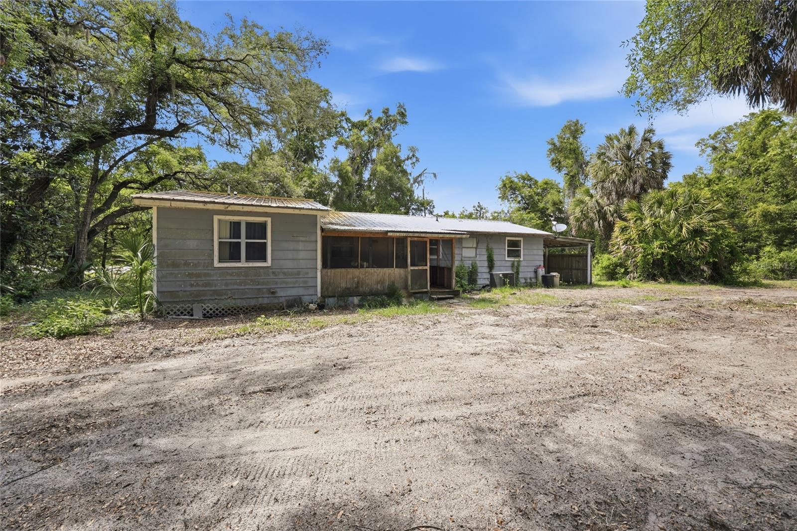 Attention investors and buyers looking for a project: this is your opportunity to get into a 3 bedroom, 2 bathroom home on 2 full acres in Old Town. Priced to reflect its current condition, this cash only purchase is ready for the right buyer to come in and make it their own.
The seller has already done some of the heavy lifting by replacing the subfloor throughout the home, giving you a solid foundation to build on as you work through the renovation. With 1,152 square feet of living space, a metal roof, central air and heat, and a carport, the bones are there. The 2-acre lot offers plenty of breathing room and the kind of privacy and elbow room that is getting harder to find at this price point.
Whether you are a seasoned investor looking to flip, a buyer who wants to build equity through sweat, or someone searching for an affordable piece of rural Florida to call home, this one is worth a look. Cash offers only. Call today to schedule your showing.