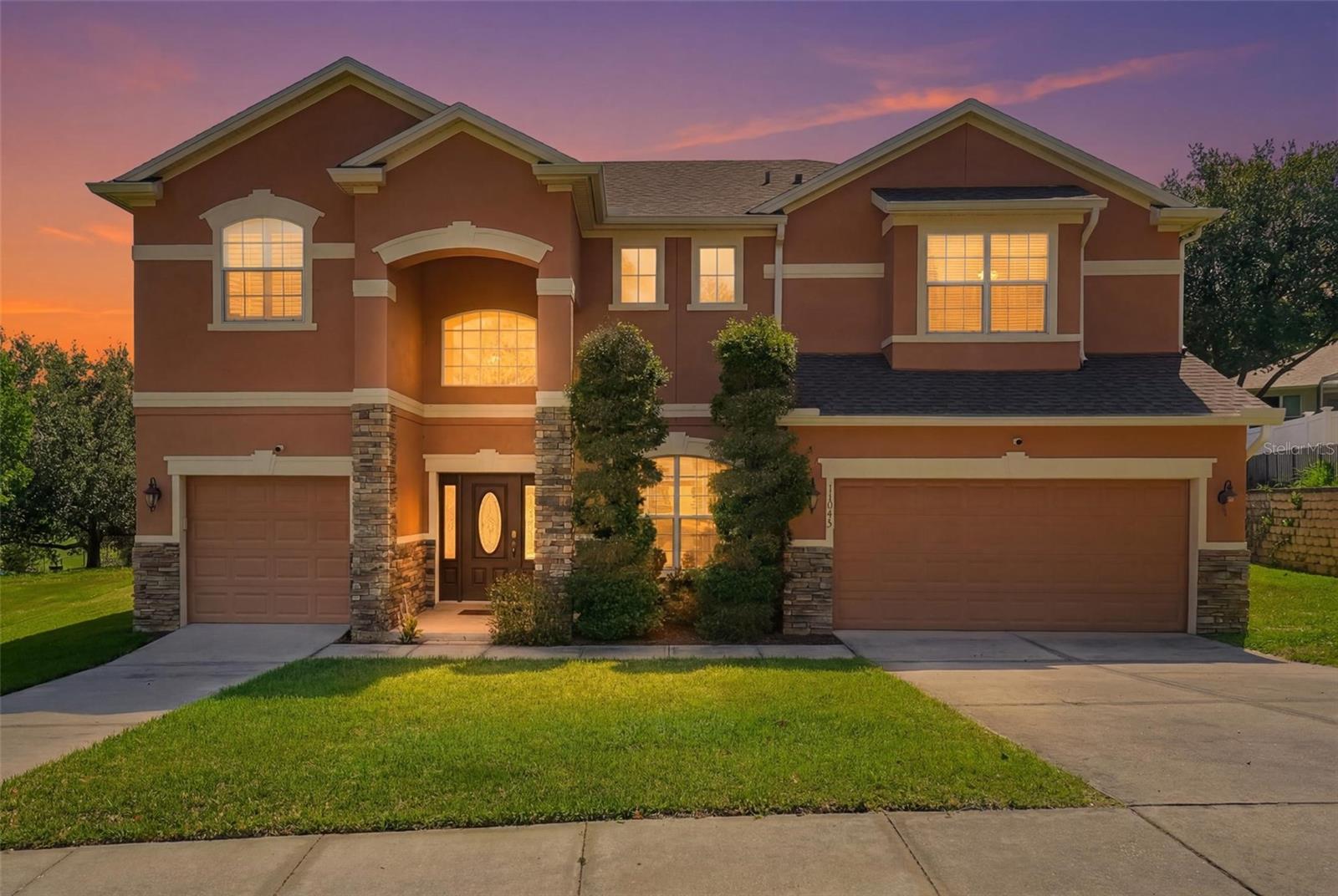Welcome to this spacious and beautifully maintained home located in the desirable Overlook at Lake Louisa community in Clermont. Offering over 3,500 square feet of living space, 5 bedrooms, 4 bathrooms, and a versatile floor plan designed for both everyday living and entertaining, this residence presents a rare opportunity to enjoy comfort, functionality, and the Florida lifestyle in one of Central Florida’s most sought-after locations.

From the moment you enter, you’ll appreciate the sense of space created by soaring ceilings, abundant natural light, and generously sized living areas. The thoughtful layout provides flexibility for a variety of living arrangements, with multiple gathering spaces that can easily accommodate large families, guests, work-from-home needs, hobbies, or multi-generational living.

At the heart of the home is a spacious kitchen that opens to the main living area, creating a natural setting for entertaining and everyday connection. The home’s expansive design includes formal and informal living spaces, providing room for both relaxation and hosting special occasions.

One of the standout features of this property is the dedicated media/theater room, offering the perfect space for movie nights, game days, gaming, or creating your own private entertainment retreat. An additional loft or bonus living area provides even more flexibility and can be utilized as a playroom, office space, fitness area, study zone, or secondary family room.

The primary suite offers a private retreat with ample space to unwind at the end of the day. Additional bedrooms are generously sized and thoughtfully positioned throughout the home to provide comfort and privacy for family members and guests alike.

Step outside and discover one of the home’s most unique features: a large L-shaped enclosed patio that extends the living space outdoors. Accessible from multiple points within the home, this expansive screened area offers endless possibilities for outdoor dining, entertaining, relaxing with a morning coffee, or enjoying Florida’s beautiful weather year-round while remaining sheltered from the elements.

Situated on an oversized homesite within the community, the property provides additional outdoor space and a sense of openness rarely found in many newer neighborhoods.

Residents of Overlook at Lake Louisa enjoy a convenient location near shopping, dining, healthcare facilities, schools, major roadways, and Clermont’s renowned outdoor recreation opportunities. Clermont is known for its scenic rolling hills, beautiful lakefront areas, parks, trails, and active lifestyle. The home is located just minutes from Lake Louisa State Park and within easy reach of the area’s famous Chain of Lakes, offering convenient access to boating, fishing, kayaking, hiking, cycling, and other outdoor activities.

Whether you’re looking for room to grow, space to entertain, or simply a place to enjoy everything Clermont has, this property delivers a combination of size, flexibility, and location that is increasingly difficult to find.

Buyer is encouraged to verify all measurements, HOA information, room dimensions, school assignments, and any property features important to their purchasing decision.