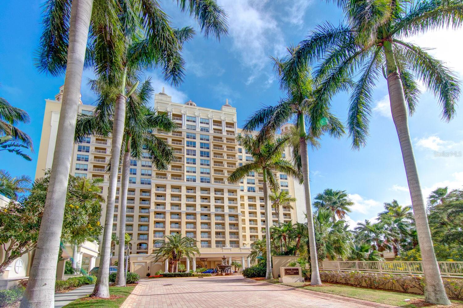 Move in ready Ritz Carlton Penthouse is the mark of distinction worldwide. 
1111 Ritz Carlton Drive, Unit 1803, Sarasota, Florida is a true penthouse perched atop the prestigious Ritz-Carlton Residences and hotel. This 4,276-square-foot masterpiece offers breathtaking panoramic views of Sarasota Bay and the vibrant downtown skyline.  
Meticulously remodeled, this residence boasts three spacious bedrooms, each with a versatile den/office space, and luxurious en-suite bathrooms. The mother-in-law suite includes its own den, kitchen, and entrance with doorbell. The open concept living area features rich wood floors and expansive windows that flood the space with natural light and showcases stunning water vistas. The state-of-the-art kitchen is a chef’s dream, equipped with brand-new Wolf appliances, a Sub-Zero refrigerator, and elegant solid wood cabinetry. The master suite is a private sanctuary, offering a lavish bathroom and a huge custom walk-in closet.  
Living at this Ritz holds a special significance. Residents enjoy exclusive access to Ritz-Carlton’s world-class amenities, including a heated bayfront pool and spa. Uniquely in Sarasota, you and your guests will be greeted by a Ritz Carlton attendant who will cover your chaise lounge, give you pool towels with one rolled on which to rest your head, and bring you a bucket of ice with bottled water. Menu service of drinks, cocktails, and food can be charged to your Residences personal tab. 
Valet guest parking is available at the main hotel entrance. The property comes with three premium extra wide parking spaces and two spacious storage areas. Newspaper and package delivery to your unit are two more of the many services.
Don’t feel like making breakfast, lunch, or supper? Call Ritz Carlton room service from Jack Dusty’s kitchen for white linen service in your room for you, two, or the whole family. Or maybe just a late-night dessert. 
The Ritz Carlton hotel provides coastal sophistication dining with two in building restaurants, Jack Dusty’s and The Rafa. Situated in the heart of Sarasota, you’re just moments away from Marina Jack, upscale dining such as the new Ocean Prime, boutique shopping, and the rich cultural offerings of the Theater District and Van Wezel Performing Arts Hall. The pristine Gulf beaches are also within easy reach, making this residence the epitome of sophisticated coastal living.  
Located as the hub of Sarasota’s finest neighborhood you will experience the pinnacle of elegance and comfort in this exceptional Ritz-Carlton penthouse. Be treated with the luxury you deserve. It can all be yours – always!