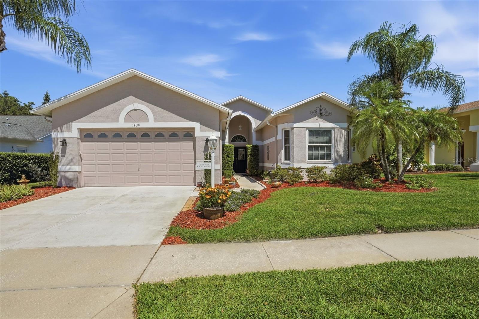 Welcome to this stunning and unique, one-of-kind, architecturally designed, 3-bedroom, 2-bathroom home, meticulously maintained, boasting 2,089 sq. ft. of open living space. It is set in Heritage Springs, an upscale 55 + private, 18-hole golf community.
The home features a spacious open concept design with soaring 10-foot ceilings in every room, creating an airy atmosphere, perfect for entertaining.
The expansive, 8-foot sliding doors, invite an abundance of natural light, seamlessly connecting the indoor and outdoor space. You can enjoy your mornings or evenings on the extended-covered, screened-in patio. Throughout the home you’ll love the REAL hardwood floors that flow throughout, complemented by tile in the wet areas.  The lush green space behind the home enhances its privacy, creating a tranquil retreat for enjoyment. The primary suite is a highlight, offering sliding doors to a private patio entrance, a walk-in closet, a linen closet, and a luxurious bathroom, complete with a nice tile shower with added ventilation and a water closet featuring a bidet. Two additional spacious bedrooms share a well-appointed bathroom, providing comfort for family, guests or even an office space. The kitchen opens to the dining and living room and includes; white cabinets and under the cabinet lighting, a handy broom closet and a pantry, maximizing storage space. The oversized garage and garage door can accommodate two trucks, large SUV plus additional storage. This home is designed for convenience. Extra features are insulated block exterior walls, a pest control line, new cam lighting, upgraded outlets, new toilets and faucets, a new garbage disposal and a propane tank. 

Residents enjoy access to a clubhouse with a highly rated restaurant, a golf course, tennis courts,
Bocce, shuffleboard, gazebo for family parties, and a temperature-controlled lap lane pool and hot tub, all within a secure, gated community. This exceptional home combines comfort, style and a vibrant lifestyle, only minutes from shopping, dining, doctor’s offices and a close drive to the Gulf water or airport, making this home must-see. Schedule your private showing today.