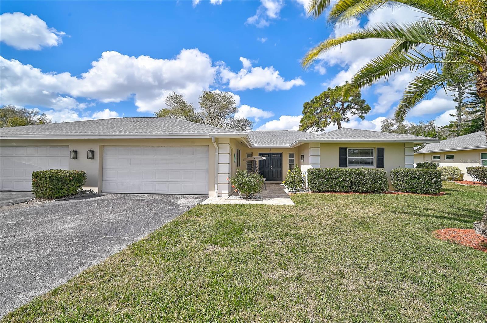 Fully Furnished Palm Aire Home with Sunroom, Golf Course Views & Oversized Garage !
Welcome to a beautifully maintained residence in the highly desirable Palm Aire golf community, where comfort, space and a relaxed Florida lifestyle come together. This spacious three-bedroom, two-bath home offers over 1,800 square feet of living space and is being offered fully furnished, making it a truly move-in ready opportunity for seasonal or year-round living. From the moment you arrive, the inviting paver entry walkway and private courtyard create a warm first impression. Inside, the home features a bright and open layout with generous living and dining areas, neutral tile flooring throughout much of the home, and large sliding glass doors that allow natural light to fill the space. One of the standout features of this property is the expansive air-conditioned sunroom, created from the original lanai. Lined with walls of windows overlooking the spacious backyard, this versatile space is perfect for entertaining, relaxing with a book, hosting guests, or enjoying morning coffee while taking in the peaceful surroundings. The kitchen is clean, functional and well maintained, featuring updated appliances and plenty of cabinet storage. Both bathrooms have been beautifully updated in recent years with modern tile work, new vanities and walk-in showers, providing a fresh and comfortable feel. The home offers a flexible three-bedroom layout including a unique suite configuration that provides additional privacy and space for visiting family, guests or a home office setup. For those who appreciate storage and functionality, the oversized two-car garage is a rare bonus and includes additional space for a golf cart. A dedicated laundry and utility room adds even more convenience. Located directly across the street from the golf course, the home enjoys scenic views and the peaceful ambiance that Palm Aire is known for. Residents love the mature landscaping, wide open green spaces and optional membership opportunities at Palm Aire Country Club. Adding even more appeal is the maintenance-free lifestyle this community offers. Residents enjoy access to two community pools, a clubhouse, shuffleboard courts and beautifully maintained grounds, allowing you to spend more time enjoying Florida living and less time worrying about upkeep. The location is truly exceptional. Situated between downtown Bradenton and downtown Sarasota, this home offers convenient access to both vibrant city centers. Lockwood Commons shopping and dining are just minutes away, along with the growing 44th Avenue corridor that connects quickly to Lakewood Ranch, University Town Center, Sarasota-Bradenton International Airport and the stunning Gulf Coast beaches. Whether you are looking for a seasonal retreat, a comfortable full-time residence or a home where guests can easily visit and stay, this property offers the perfect combination of space, location and lifestyle. Schedule your private showing today!