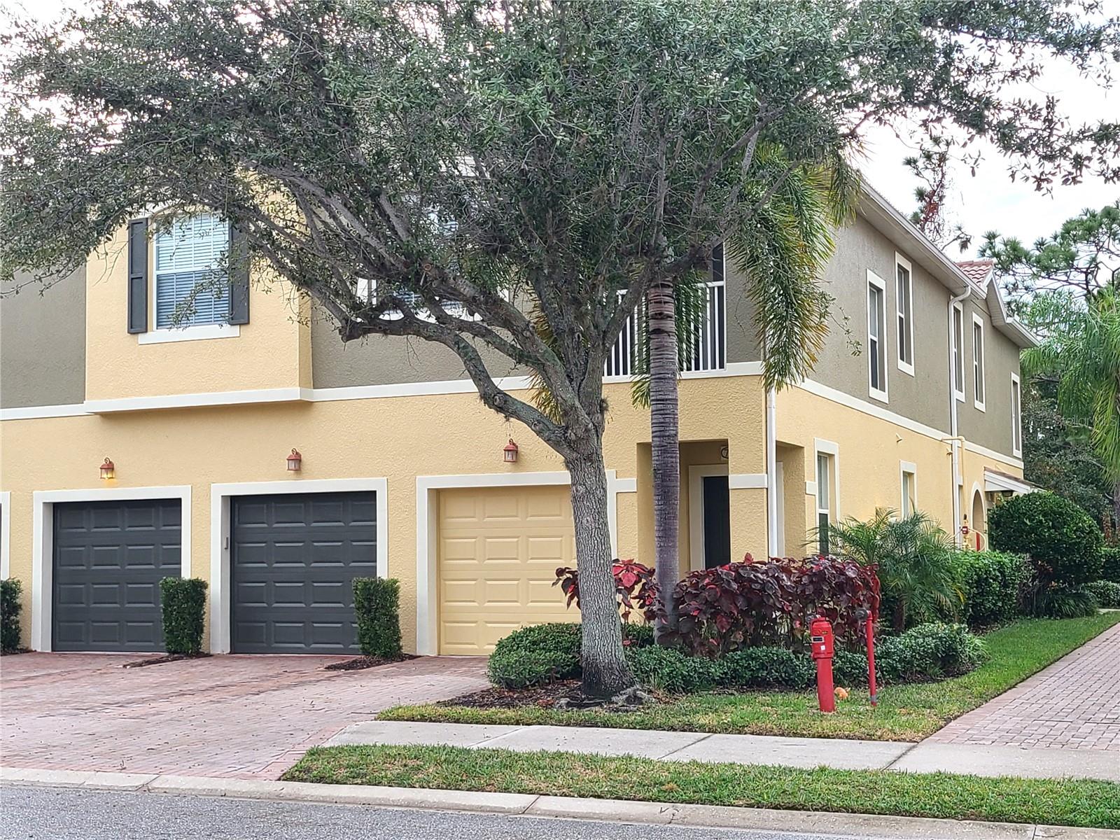 This second floor 2-bedroom/2 bath unit with 1-car garage is convenient to almost everything you need.  It is upgraded with granite counter tops, wood cabinets, wood flooring, and stainless steel appliances. The community is gated with community pool and child play area.  Across the street you will find a variety of shops including grocery store, and restaurants. Convenient location with easy access to highway and about 7 miles to the beautiful Siesta Beach!