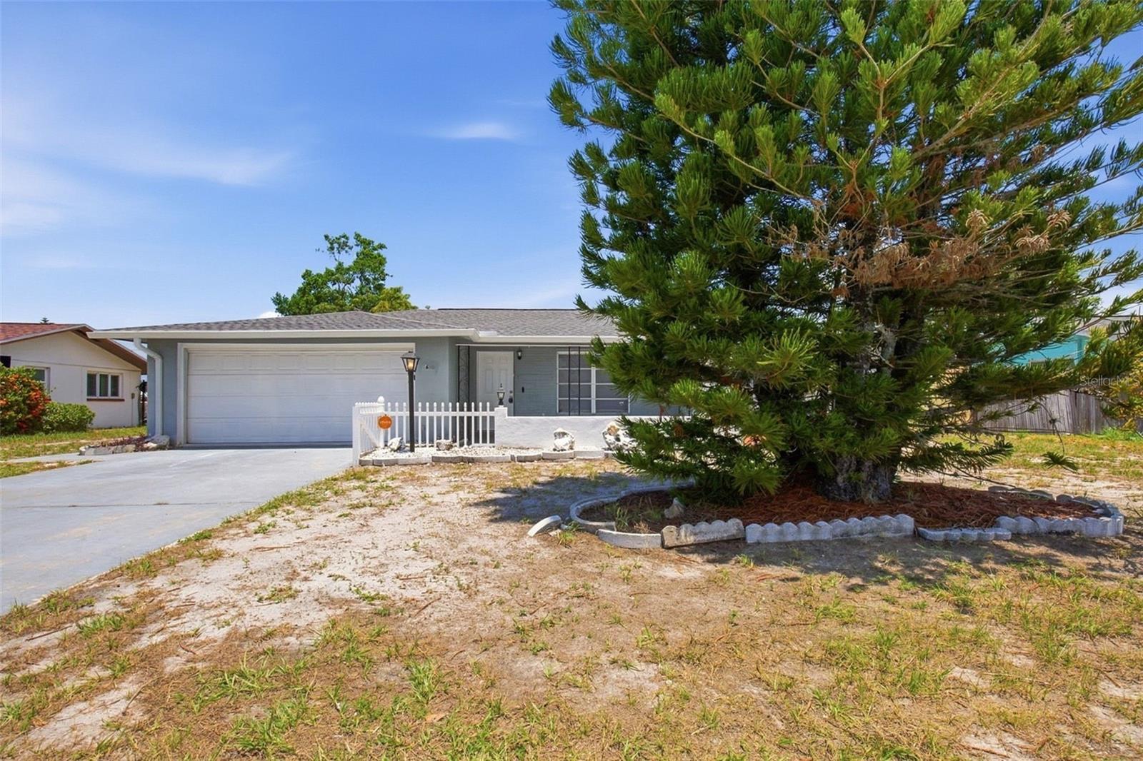 Welcome to this Port Richey home located in the established Jasmine Lakes community. This property offers a comfortable layout with spacious living areas, well-sized bedrooms, and a functional design ready for its next owner. Enjoy the convenience of nearby shopping, dining, parks, and everyday amenities while being just a short drive from major roadways and local attractions. Whether you are looking for a place to make your own or an opportunity to add personal touches, this home provides a great option in a desirable Pasco County location.