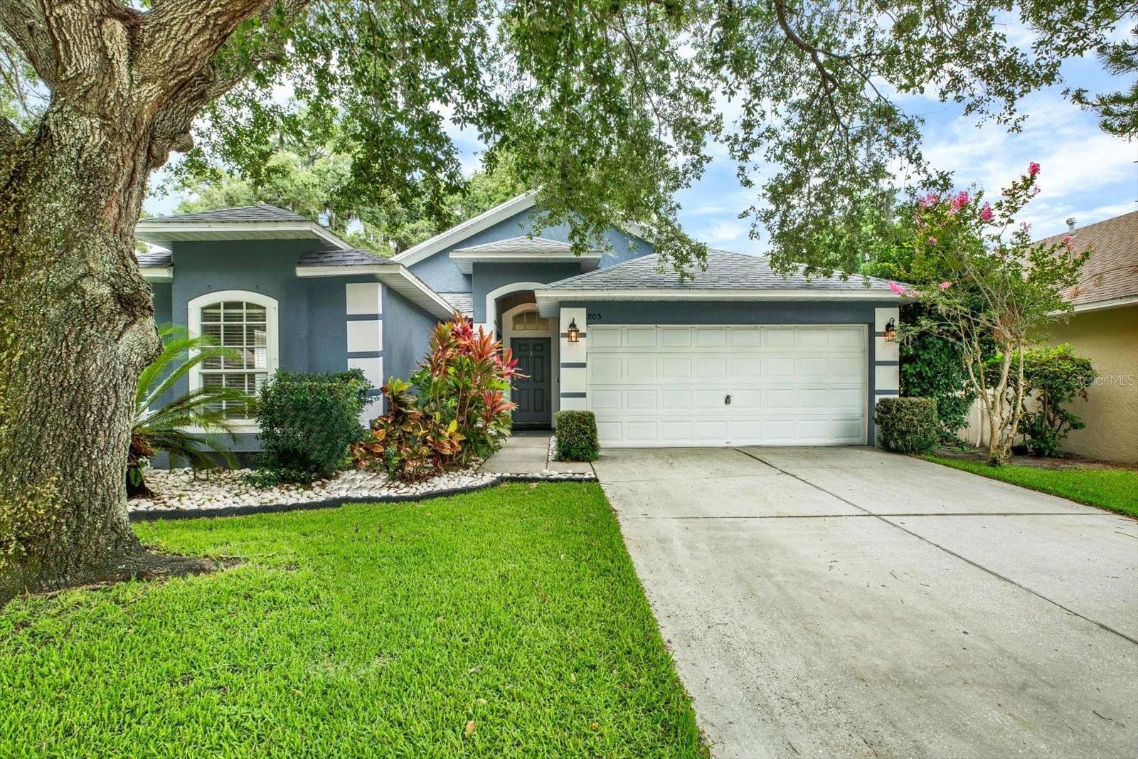 Welcome to this well-maintained 3-bedroom, 2-bathroom single-family home offering 1,591 square feet of comfortable living space in a desirable gated community. Built in 2001, this home features an open-concept floor plan designed for both everyday living and effortless entertaining. The spacious kitchen is equipped with stainless steel appliances, elegant quartz countertops, and ample workspace, flowing seamlessly into the main living and dining areas. The private primary suite serves as a relaxing retreat. The Primary suite includes a walk-in closet and an en-suite bathroom with both a soaking tub and separate shower. Additional highlights include a dedicated laundry room, a two-car garage, beautifully maintained landscaping and mature tropical plantings that enhance the home's curb appeal, and a fully fenced backyard—perfect for pets, play, gardening, or outdoor gatherings. Major updates provide added peace of mind, including a new roof installed in 2020 and an AC system replaced in 2017. Situated adjacent to a cul-de-sac, the property enjoys a desirable location with reduced through traffic and added privacy. Conveniently located in the heart of Brandon, this home is approximately 10 minutes from Brandon Town Center, Brandon Regional Hospital, schools, shopping, dining, and major commuter routes, making it an ideal choice for families and professionals alike. Offered at $357,000. Schedule your private showing today!