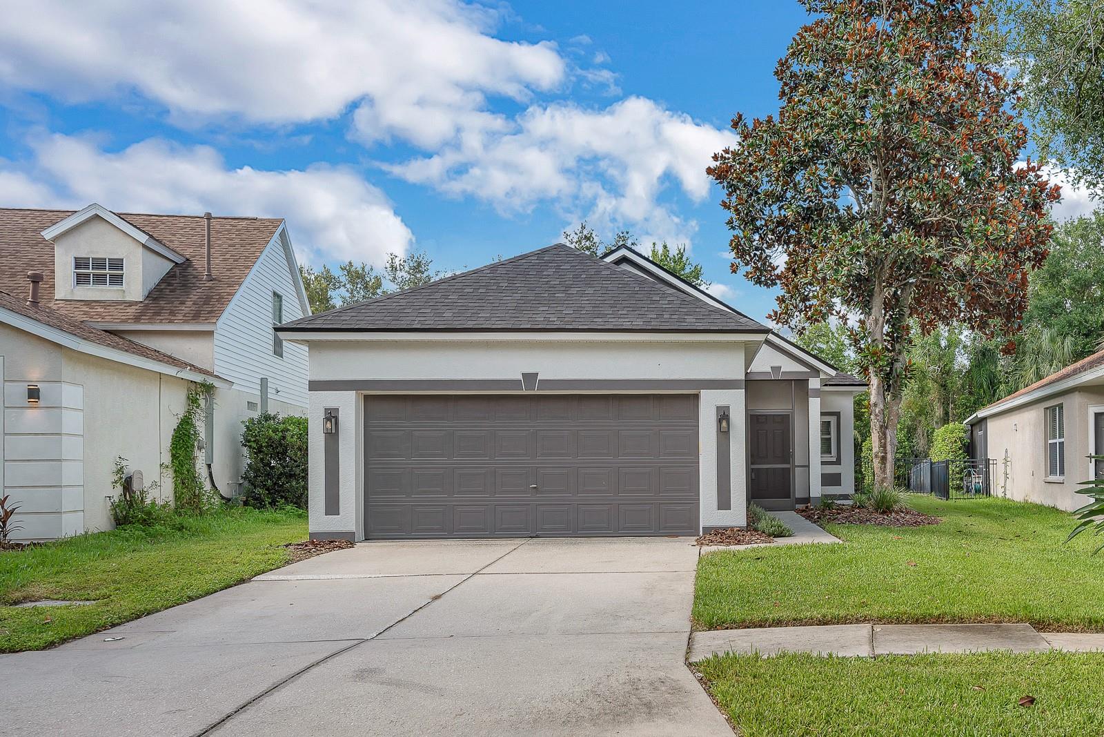 Welcome to easy Florida living in FishHawk Ranch, where everyday comfort meets community. This single-story home offers 3 bedrooms, 2 baths, and a bright, open layout designed to make daily life feel simple and connected.
Inside, light wood-look flooring carries through the main living spaces, creating a clean, cohesive feel from the front entry through the dining, kitchen, living areas. The updated kitchen brings a crisp modern look with white cabinetry, stone counters, subway tile backsplash, stainless steel appliances, a gas range, pantry storage, and a contrasting island that gives the space a polished focal point. The open living area extends naturally from the kitchen, with built-ins, arched architectural details, updated lighting, and sliding glass doors that bring in backyard views.
The split-bedroom layout gives the primary suite its own sense of privacy, while two additional bedrooms offer flexibility for guests, work-from-home needs, hobbies, or everyday life. Outside, the screened rear porch and fenced backyard provide a private place to relax, grill, or enjoy the Florida weather.
Located in FishHawk Ranch, residents enjoy access to community amenities including pools, fitness center, parks, trails, clubhouse space, and top schools. Clean, comfortable, and easy to live in, this home offers a move-in-ready feel in a location that continues to be one of the area’s strongest draws.