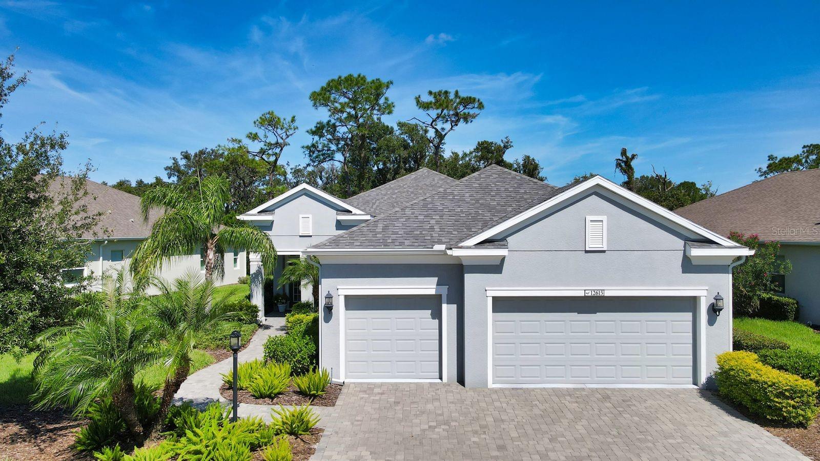 Eagle Trace is a *maintenance free, gated community, located near the north end of Lakewood Ranch. This master planned community of 272 homes sits on 104 acres, much of which is dedicated to preserving nature. Neighborhood amenities include a community center with a swimming pool, spa, tennis courts, playground and outdoor entertainment area with gas grill and covered seating area and NO CDD FEES in this neighborhood. The community also includes 2 parks for your best dog friend. You are sure to be impressed with this Bright Meadow floor plan by Neal Signature Homes with over 2,300 sq ft. of living space. It was awarded “Best Kitchen” and “Best Floorplan” by the Parade of Homes. This home features 3 bedrooms, plus a flex room that can be used as an office or guest bedroom, and 2.5 bathrooms. The owner spared no expense, adding the optional pool bathroom, split vanity in the owner’s suite, extended the 3-car garage, added a Halo water treatment system, a Generac whole home generator and extended lanai and pool. Interior finish upgrades included plantation shutters, crown moldings, designer level carpets in the bedrooms, premium vinyl flooring in the den, laundry room cabinets and recessed lighting in the bedrooms. The floor plan features an oversized family room with lots of natural light that opens to a spacious kitchen and dining area. The kitchen’s white cabinets are complimented by the gray solid surface countertops and glass accent tile backsplash. Other elements of the kitchen include an oversized walk-in pantry, large island with 29” wide single bowl undermount sink, upgraded slate (smudge-proof) stainless appliances, including a range with convection double oven option and under cabinet lighting. Just off the family room is a sizeable den with corner window featuring custom pleated shades accented with designer drapery panels and a rich tone vinyl wood floor. The owner’s suite with en-suite bathroom is very spacious and bright with many windows that allow you to take in scenic views of the nature preserve and lanai. The spacious bathroom functions well with 2 separate vanities, walk-in corner shower, private toilet closet and two walk-in closets. Secondary bedrooms also feature designer carpets in taupe tone, window treatments, large walk-in closets, recessed lights and lots of natural light. The half bath is conveniently located next to the lanai and pool area and the laundry room is located near secondary bedrooms and garage. The 3-car garage includes a laundry sink and 2 Lift Master garage door openers, and 2 Onrax overhead storage racks (standing cabinets do not convey). Request a furniture feature sheet for items included. *Maintenance includes mowing, fertilizing, trimming and mulch only. Come see for yourself what everyone is talking about. This community is conveniently located near University Town Center Mall, Benderson Park, Waterside Village Town Center and Lakewood Main St Shoppes and Dining. It is approx. 45 miles to Tampa and approx. 25 miles to Florida’s best gulf coast beaches, Lido Key, Siesta Key Beach and Holmes Beach.