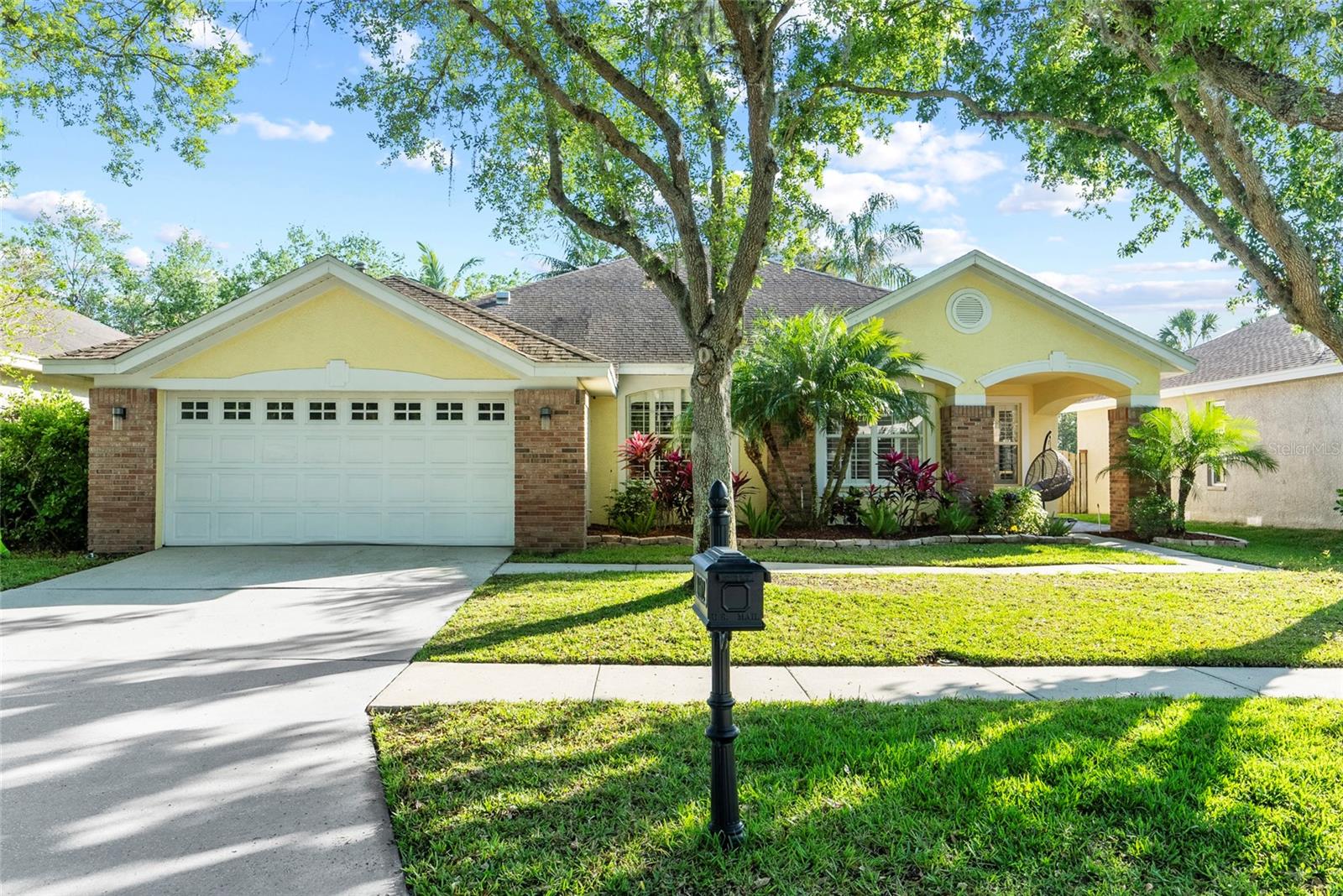 This beautiful 4-bedroom, 2-bath pool home is located in the heart of Westchase, one of Tampa’s most sought-after neighborhoods known for its charm, walkability, and top-rated schools. Thoughtfully designed with both comfort and function in mind, the home features an open layout with high ceilings, polished porcelain tile throughout the main living areas, and warm laminate flooring in the bedrooms. The kitchen is a standout, offering white soft-close cabinetry, Quartzite countertops, stainless steel appliances, and a cozy breakfast nook that overlooks the private backyard. Step outside to your own retreat—complete with a screened-in pool and spa surrounded by lush landscaping, perfect for relaxing afternoons or weekend entertaining. The family room features a gas fireplace and flows seamlessly into the kitchen and breakfast area, while the separate living and dining rooms provide flexible space for gatherings, holidays, or everyday use. The split-bedroom floorplan ensures privacy, with a spacious primary suite and updated bathrooms that offer comfort and style. Beyond the home itself, the location is ideal. Westchase Town Center is just a short walk away, offering neighborhood favorites like Irish 31, Tijuana Flats, Catch 23, boutique shops, coffee spots, and local services. Residents also enjoy access to two community pools, tennis and pickleball courts, golf, playgrounds, and scenic walking trails. The neighborhood's central location means you're just minutes from the Veterans Expressway, Tampa International Airport, International Plaza, Citrus Park Mall, Midtown Tampa, and top universities like USF and the University of Tampa. Whether you're heading to Clearwater Beach, Honeymoon Island, Busch Gardens, or downtown Tampa, it's all within a 45-minute drive. This move-in-ready home pairs thoughtful updates with a prime location in one of Tampa’s most established and well-connected communities.