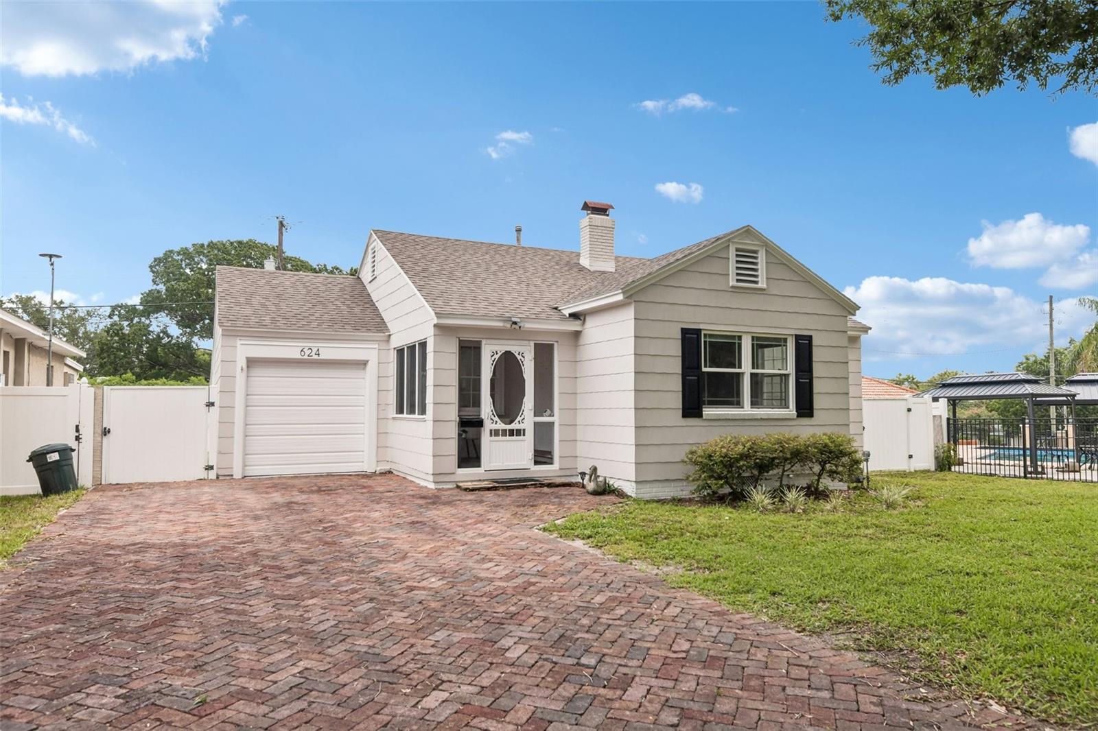 Step into the timeless charm of historic Lakeland with this beautifully maintained 1938 bungalow, ideally located just three blocks from the picturesque shores of **Lake Hollingsworth** and moments from the shopping, dining, and everyday conveniences of **Southgate Plaza**. Nestled along a classic **brick roadway** and featuring a **brick driveway**, this home captures the character and nostalgia that make this neighborhood one of Lakeland's most beloved.

Offering **2 bedrooms, 1 bathroom, and 950 square feet** of thoughtfully maintained living space, this move-in ready home is rich with original details, including beautiful hardwood floors, cedar-lined closets, original interior doors, and vintage glass doorknobs that showcase the craftsmanship of a bygone era.

The updated kitchen blends modern functionality with timeless appeal, featuring wood cabinetry, solid surface countertops, stainless steel appliances, and easy access to the spacious, fully fenced backyard. Whether you're entertaining friends on the large deck, enjoying a quiet morning coffee, or simply relaxing outdoors, this backyard is ready to be enjoyed.

Designed for both charm and peace of mind, the home has been thoughtfully updated with **new interior and exterior paint, a 5-year-old architectural shingle roof, updated plumbing supply lines, and a new electrical panel.**

Whether you're searching for your first home, looking to downsize, or dreaming of living in one of Lakeland's most sought-after neighborhoods, this home offers the perfect combination of historic character, modern updates, and an unbeatable location. Homes like this are more than a place to live—they're an opportunity to experience the charm, walkability, and lifestyle that make the heart of Lakeland so special.
