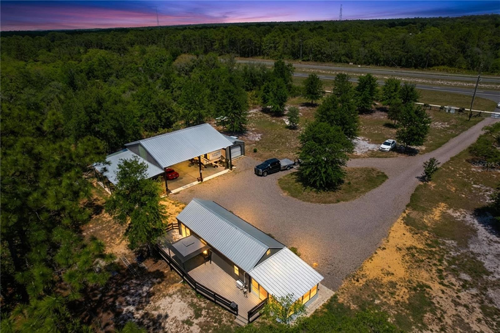 One or more photo(s) has been virtually staged. Prime commercial potential in a high-visibility location on US 19 in Homosassa. Situated just south of US 98 and north of Hwy 50, this 2.29-acre property offers exceptional exposure in one of the area’s most desirable growth corridors. Currently zoned Rural Residential, the property may offer future rezoning opportunities to fit a variety of commercial or mixed-use visions.
The fully fenced parcel features gated access, a circular driveway, and beautifully maintained landscaping, creating a polished and functional setting from the moment you arrive. A substantial 40x40 steel pole barn provides ample space for equipment, vehicles, RVs, ATVs, tools, or business storage needs. Additional improvements include a versatile 640-square-foot multipurpose shed ideal for an office, studio, workspace, or guest accommodations, along with a separate 18x24 garage.
Equipped with a well and oversized septic system, this property is already prepared for future development, business use, or a unique live-work opportunity. Whether you're seeking investment potential, commercial visibility, or space to bring your vision to life, this property delivers endless possibilities. Schedule your private showing today.