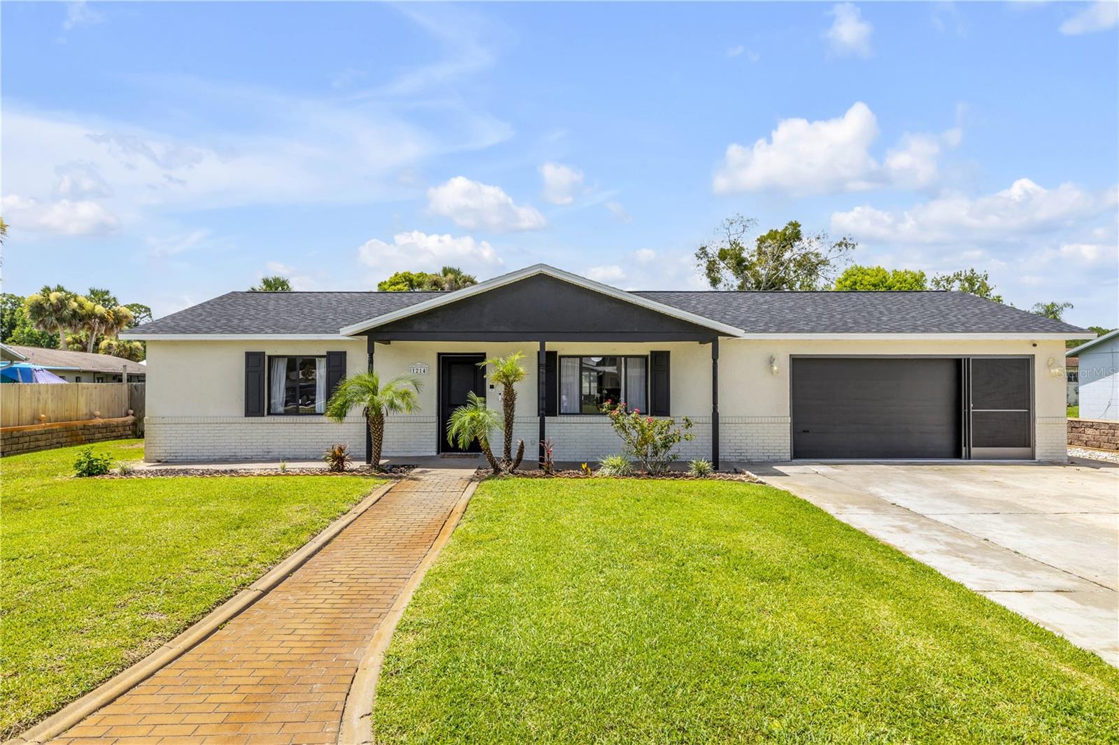 Welcome home to this beautifully remodeled, move-in ready residence in the desirable Willow Run community! Offering **2 bedrooms, 2 bathrooms, a 2-car garage, a versatile sunroom with AC and above ground pool**, this solid block home has been thoughtfully updated with today's modern finishes while providing the comfort and convenience buyers are looking for.

The heart of the home is the stunning chef-inspired kitchen featuring **42-inch white solid wood shaker cabinetry with soft-close drawers**, elegant **quartz countertops**, a stylish tile backsplash, **stainless steel appliances**, and an impressive **8-foot center island** that's perfect for entertaining, meal prep, or gathering with family and friends.

Luxury **porcelain wood-look tile flooring flows throughout the home**, complemented by updated interior doors, trim, and custom closet shelving, creating a fresh, cohesive feel from room to room.

Step outside to enjoy the **fully fenced backyard**, complete with a storage shed for extra space and a screened garage door, allowing you to enjoy the Florida breeze while working or relaxing in the garage. A newer A/C provides added peace of mind.

Ideally situated within a short distance to the **City Center, Library, and YMCA**, and just minutes from Dunlawton Avenue's shopping, dining, schools, and everyday conveniences, this home offers the perfect combination of style, functionality, and location.

Whether you're looking for your first home, downsizing, or searching for a low-maintenance Florida lifestyle, this Willow Run gem is ready to welcome you home.