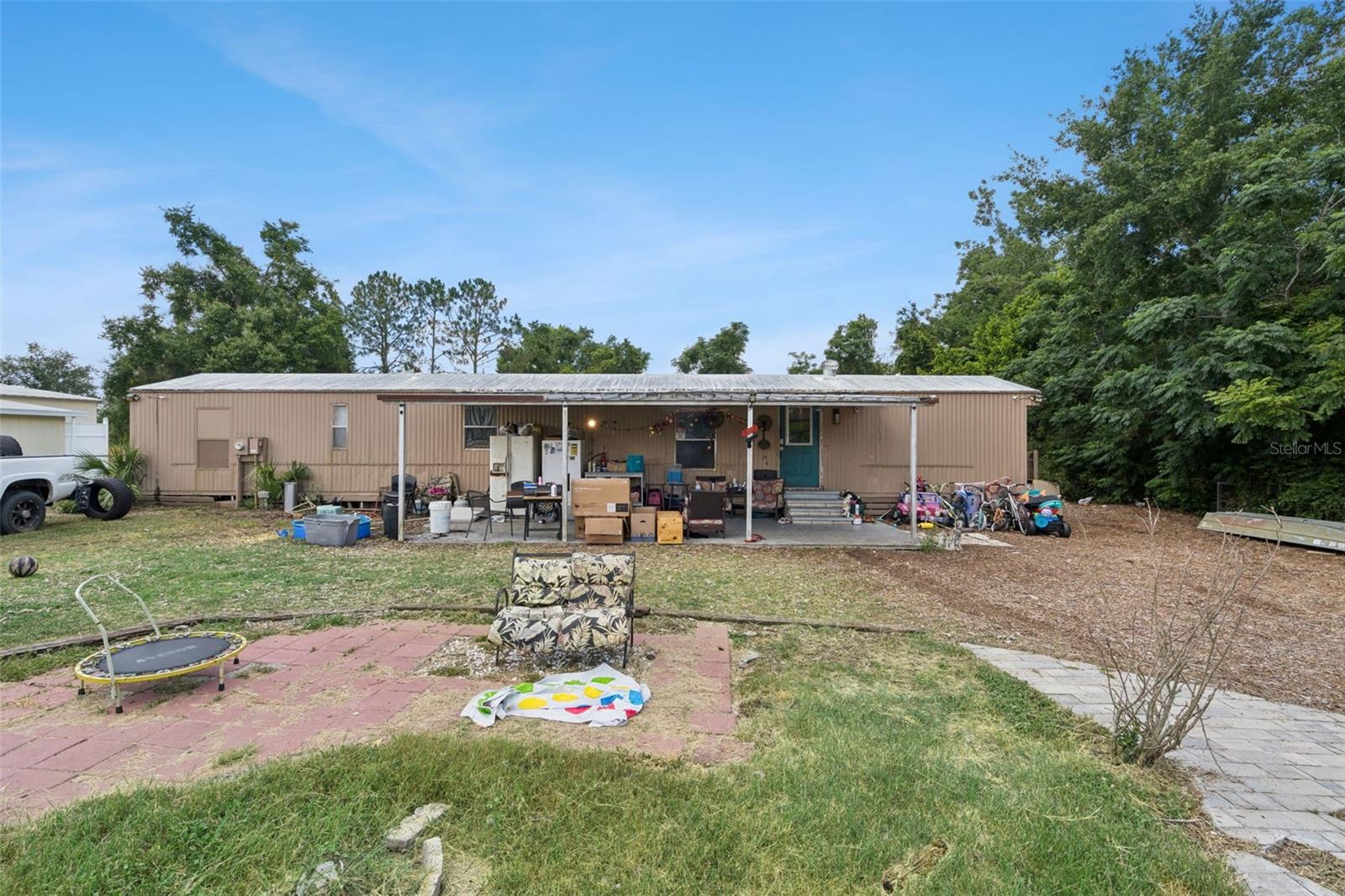 Welcome to this charming and affordable 2 bedroom, 2 bath manufactured home situated on an oversized 1/3 acre lot in the heart of Leesburg, Florida. NO HOA & NO LOT RENT. Since being listed, the home has already seen several thoughtful improvements, including freshly painted walls in one bedroom, one bathroom, and both hallways leading into the kitchen and living room, professionally patched drywall, and ongoing flooring updates in one bathroom and along the edge of the living room, with additional improvements still to come. Built in 1985 and featuring a versatile bonus room that can serve as a home office, hobby room, guest space, or additional living area, this property offers outstanding value and endless possibilities for homeowners and investors alike. The spacious, cleared one-third acre lot provides plenty of room for outdoor entertaining, gardening, RV or boat parking, future improvements, or simply enjoying the open space. Located outside of a flood zone, you'll enjoy added peace of mind while benefiting from lower insurance considerations. Whether you're a first-time homebuyer looking for an affordable place to call home, a seasonal resident seeking a Florida retreat, or an investor searching for a promising rental opportunity, this property offers exceptional value and potential. Leesburg is known for its abundance of recreational activities and outdoor attractions. Enjoy boating, fishing, and waterfront dining along the Harris Chain of Lakes, explore scenic trails and wildlife at Venetian Gardens, tee off at nearby golf courses, or spend weekends discovering local parks, festivals, farmers markets, and charming downtown shops and restaurants. Convenient access to Orlando, The Villages, and Central Florida's world-famous attractions makes this location ideal for both relaxation and adventure. Don't miss this opportunity to own a spacious property with room to grow in one of Central Florida's most enjoyable communities.