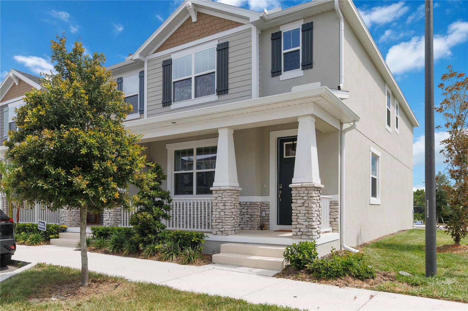 Welcome to 1326 Tarflower Drive, a stunning 2025-built townhome located in the highly sought-after Hickory Grove community in Winter Springs. Perfectly positioned on one of the most desirable lots in the neighborhood, this rare corner-unit offers exceptional privacy, abundant natural light, and beautiful green space views. With no neighboring building on one side, two mature magnolia trees, and no directly facing homes behind, this home provides a bright, open, and peaceful setting that is hard to find.

Inside, you'll find an open-concept floor plan featuring wood-look plank tile flooring, a spacious living room, dedicated dining area, and a beautifully appointed kitchen complete with a large peninsula island, marble countertops, modern cabinetry, and upgraded Charcoal stainless steel appliances—a premium upgrade not typically found.

The first floor also features a convenient drop zone and half bath. Upstairs offers four spacious bedrooms, providing flexibility for guests, a home office, nursery, or playroom. The primary suite is filled with natural light and features dual vanities, a large walk-in shower, private water closet, and an  walk-in closet. A guest bathroom with dual sinks and a tiled tub/shower combination serves the additional bedrooms.

Residents of Hickory Grove enjoy amenities including a community pool, playground, and dog park. The HOA also includes high-speed fiber internet and cable, providing added value and convenience. Located just steps from Winter Springs Town Center, you'll enjoy walkable access to Publix, restaurants, shopping, and everyday conveniences. Central Winds Park, Winter Springs High School, Tuskawilla Road, and SR-417 are all just minutes away.

Opportunities to own a premium corner-unit in one of Winter Springs' newest communities are rare. Combining modern construction, upgraded finishes, privacy, natural light, and an unbeatable location, this move-in-ready home is one you won't want to miss.